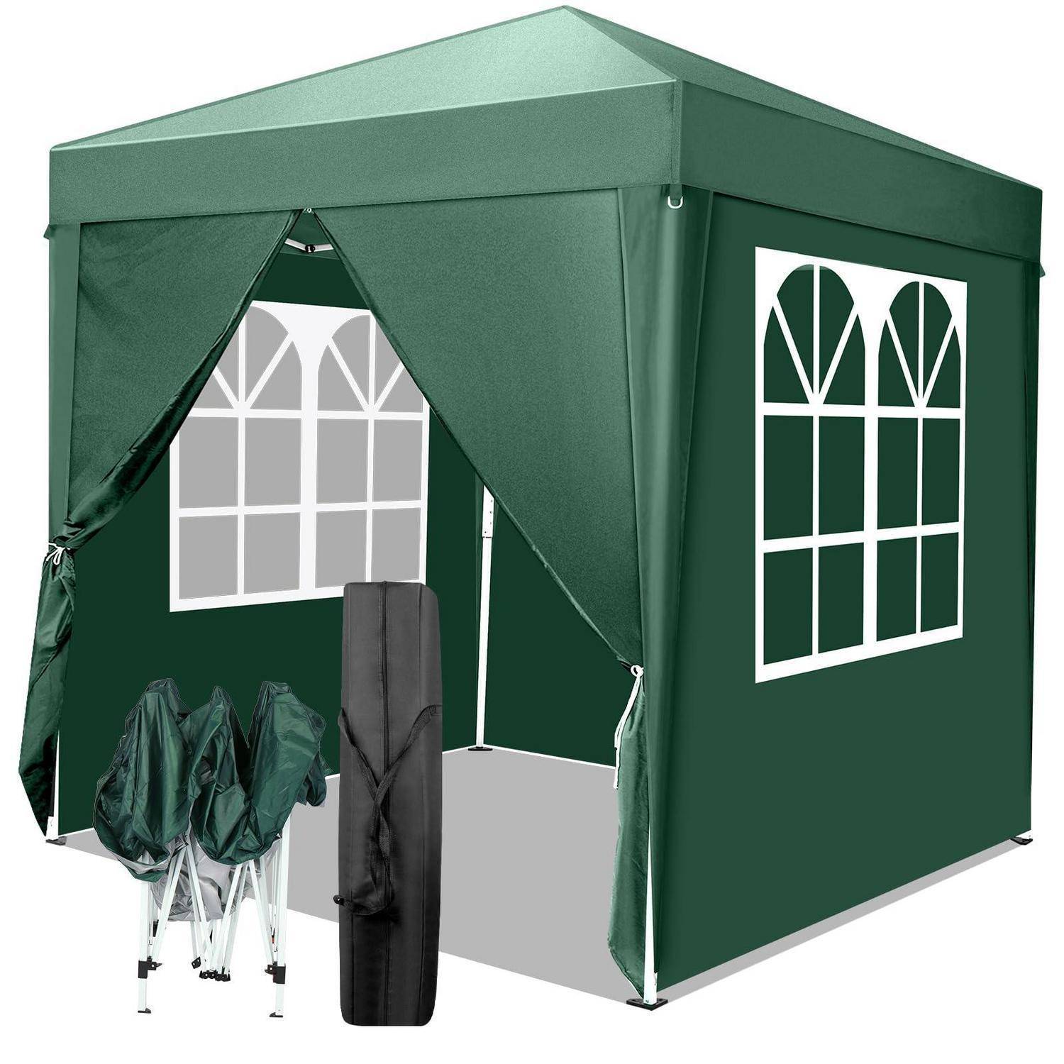 Grünes Pop-Up-Pavillion-Zelt mit Fensterfeldern, offenen vorderen Vorhängen und Tragetasche sowie zusammengeklapptem Gestell daneben.