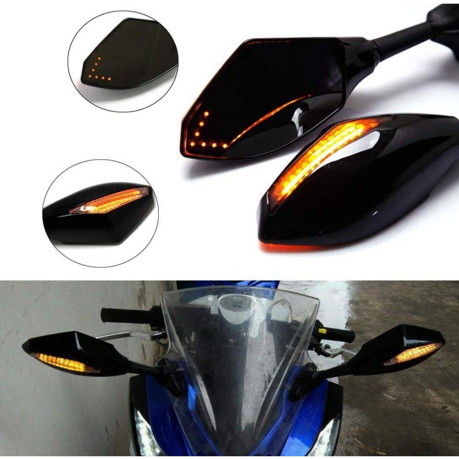 Motorrad-Rückspiegel mit integrierten bernsteinfarbenen LED-Blinkern, in Großaufnahme dargestellt und auf einem blauen Sportmotorrad installiert.