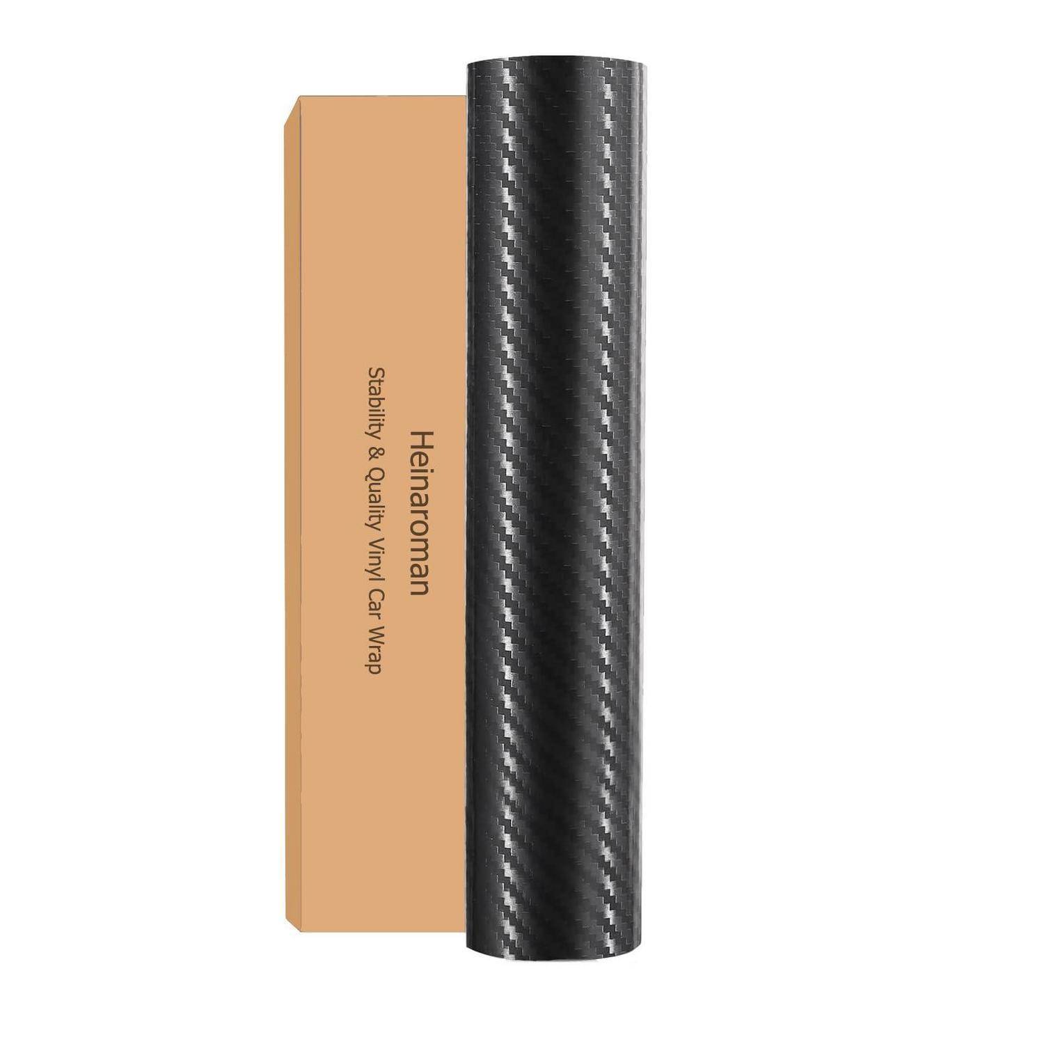 Schwarze Kohlefaser-Vinyl-Wickelrolle, die neben einer beige Schachtel mit der Aufschrift „Heinaroman Stability & Quality Vinyl Car Wrap