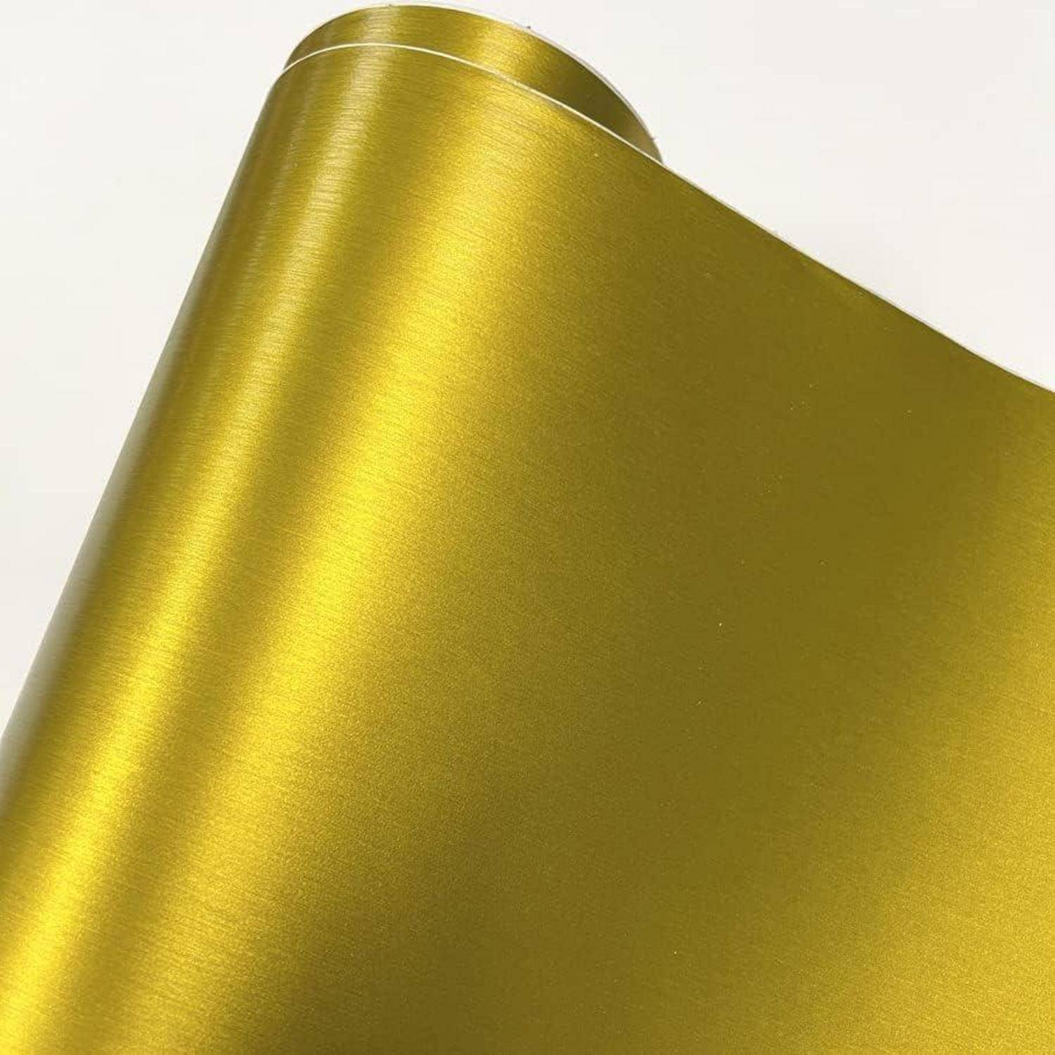 Nahaufnahme von gerollter metallischer Goldfolie oder Geschenkpapier mit einer glänzenden reflektierenden Oberfläche.