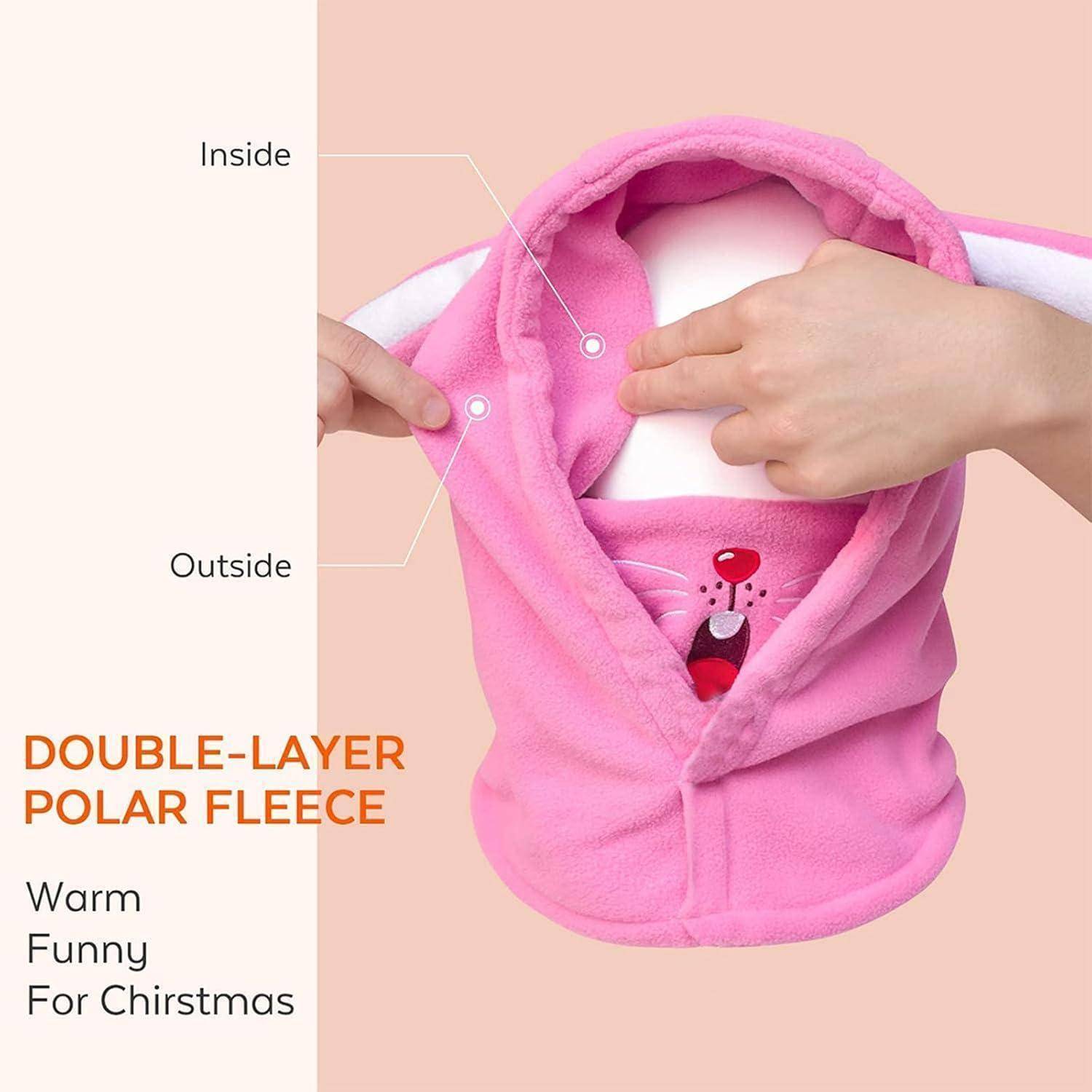 Rosa Kapuzen-Fleeceweste in Nahaufnahme, beschriftet mit „Innen" und „Außen"" um die doppellagige Polarfleece hervorzuheben; der Text lautet „DOPPELLAGIGES POLARFLEECE"" mit „Warm Lustig Für Weihnachten"".