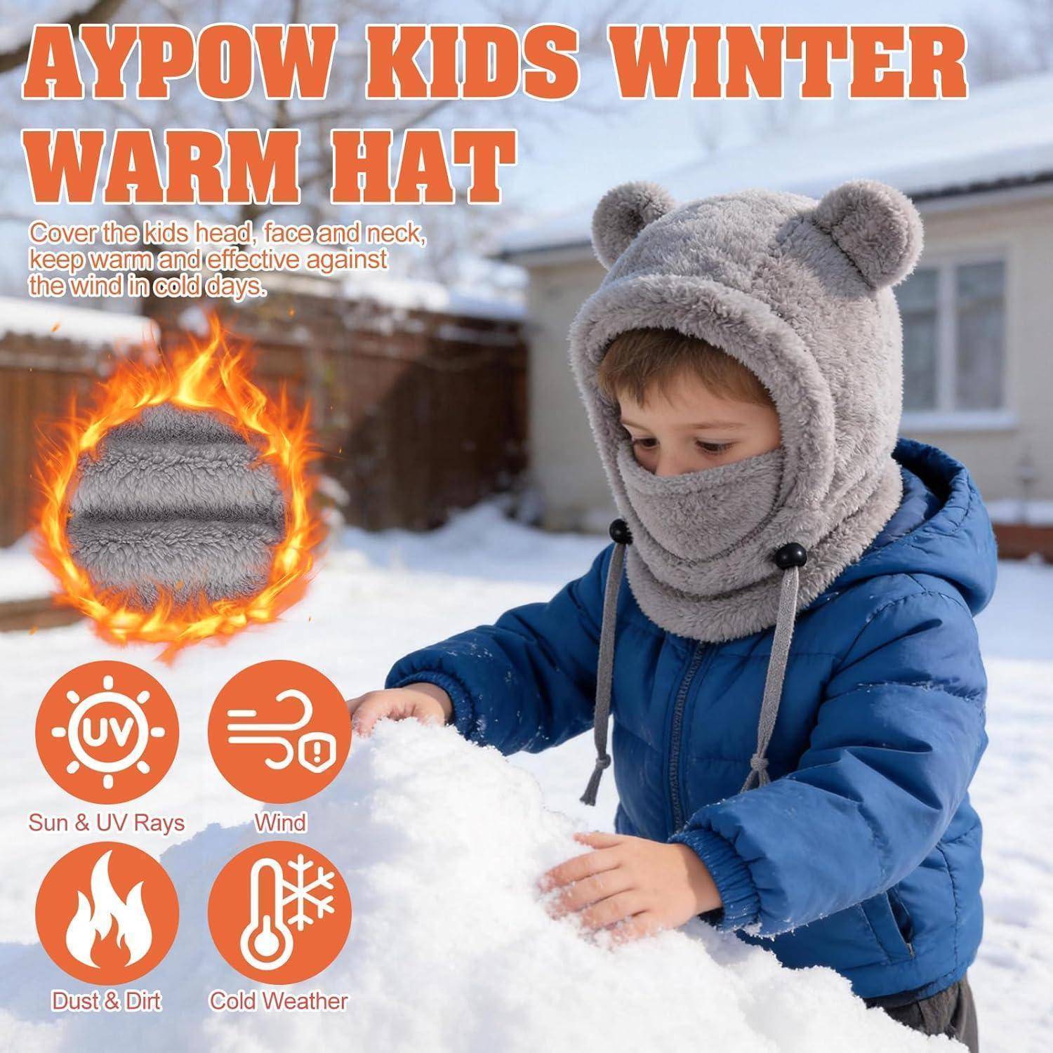 Anzeige für die 'AYPOW KIDS WINTER WARM HAT' mit einem Kind in einem blauen Mantel, das eine Fleecemütze und eine Gesichtsabdeckung im Schnee trägt, mit Symbolen für Schutz vor Sonne, Wind, Staub und Kältewetter.