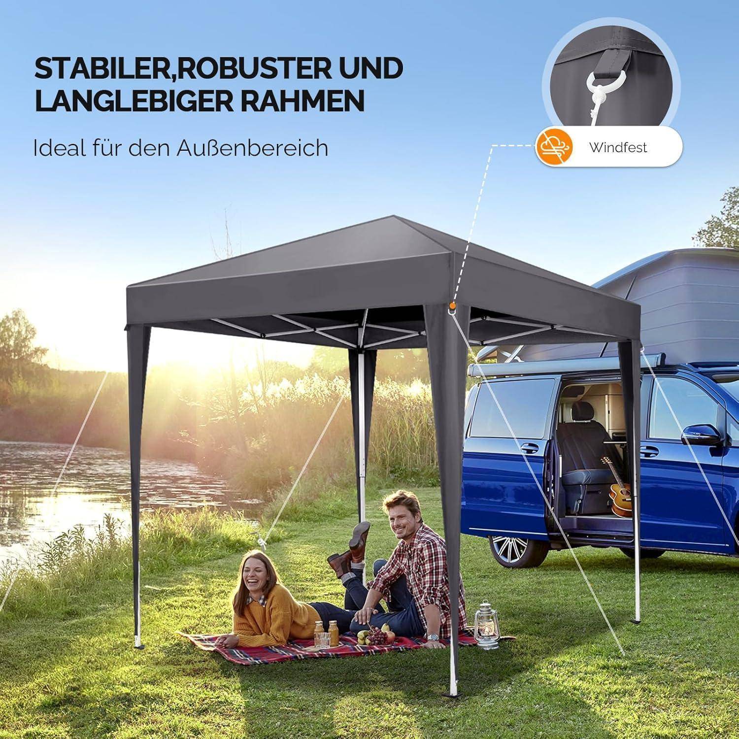 Outdoor-Popup-Baldacherzelt mit stabilem Rahmen, dargestellt als windsicher, schützend zwei Personen bei einem Picknick neben einem blauen Lieferwagen am Seeufer.