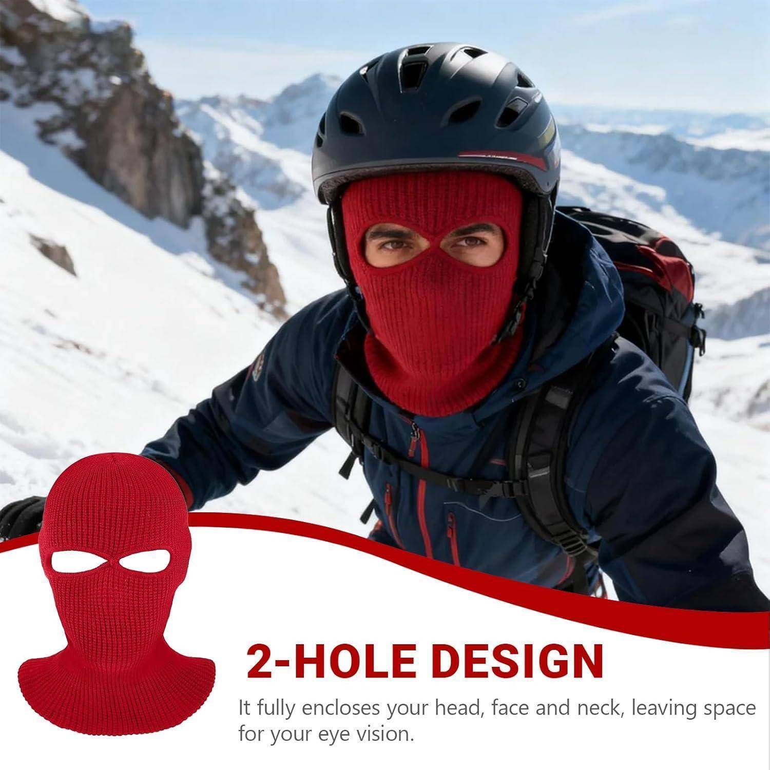 Rote Ski-Sturmhaube, gezeigt an einem Kletterer in schneebedeckten Bergen, mit dem Text „2-LOCH-DESIGN", das angibt, dass sie den Kopf, das Gesicht und den Nacken vollständig bedeckt und nur Öffnungen für die Augen freilässt.