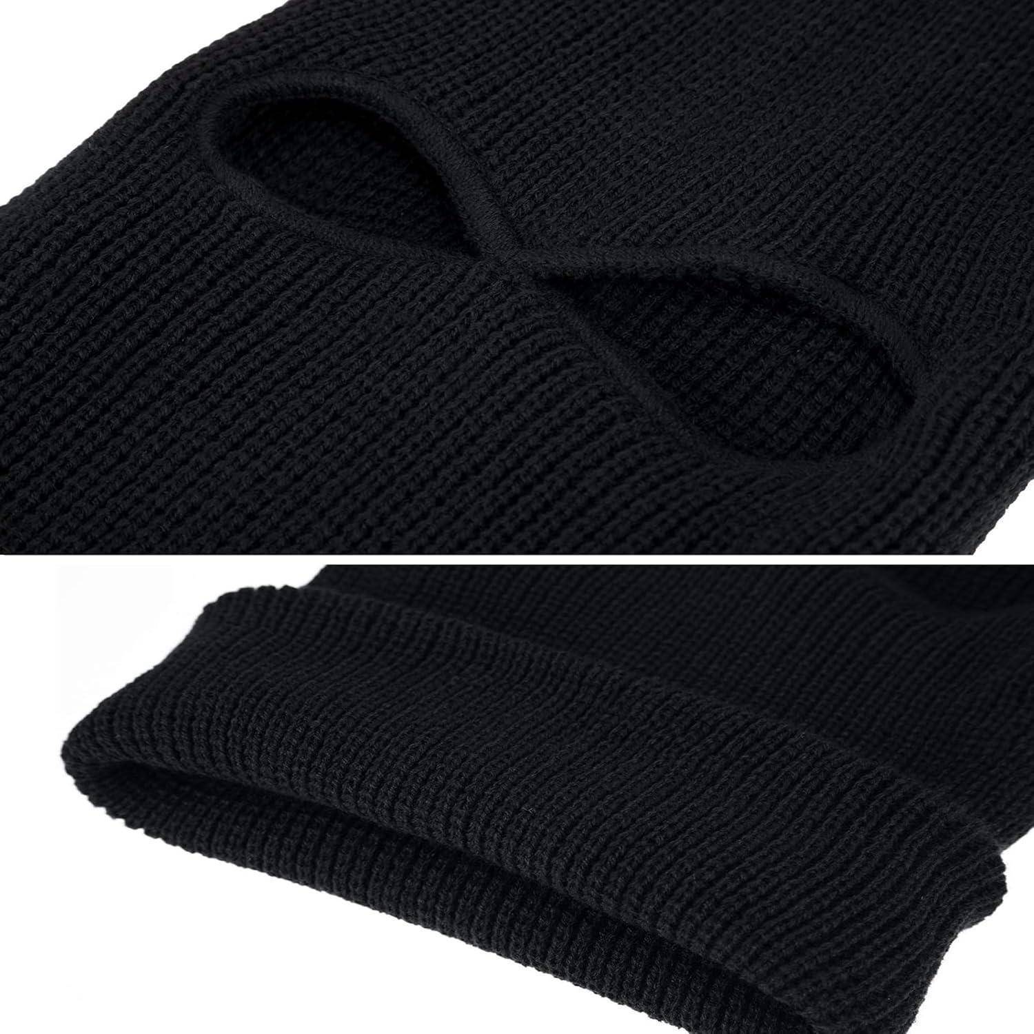 Schwarze Strickmütze mit integrierten ovalen Augenlöchern, in zwei Nahaufnahmen auf weißem Hintergrund dargestellt.