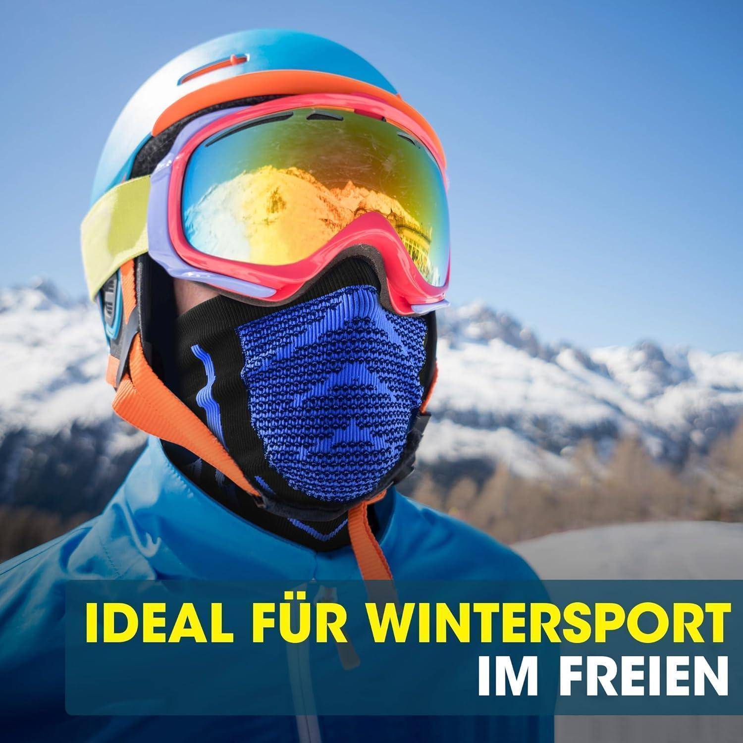 Person in Winterausrüstung mit Schutzbrille und Gesichtsmaske, schneebedeckte Berge im Hintergrund; Text lautet „IDEAL FÜR WINTERSPORT IM FREIEN".