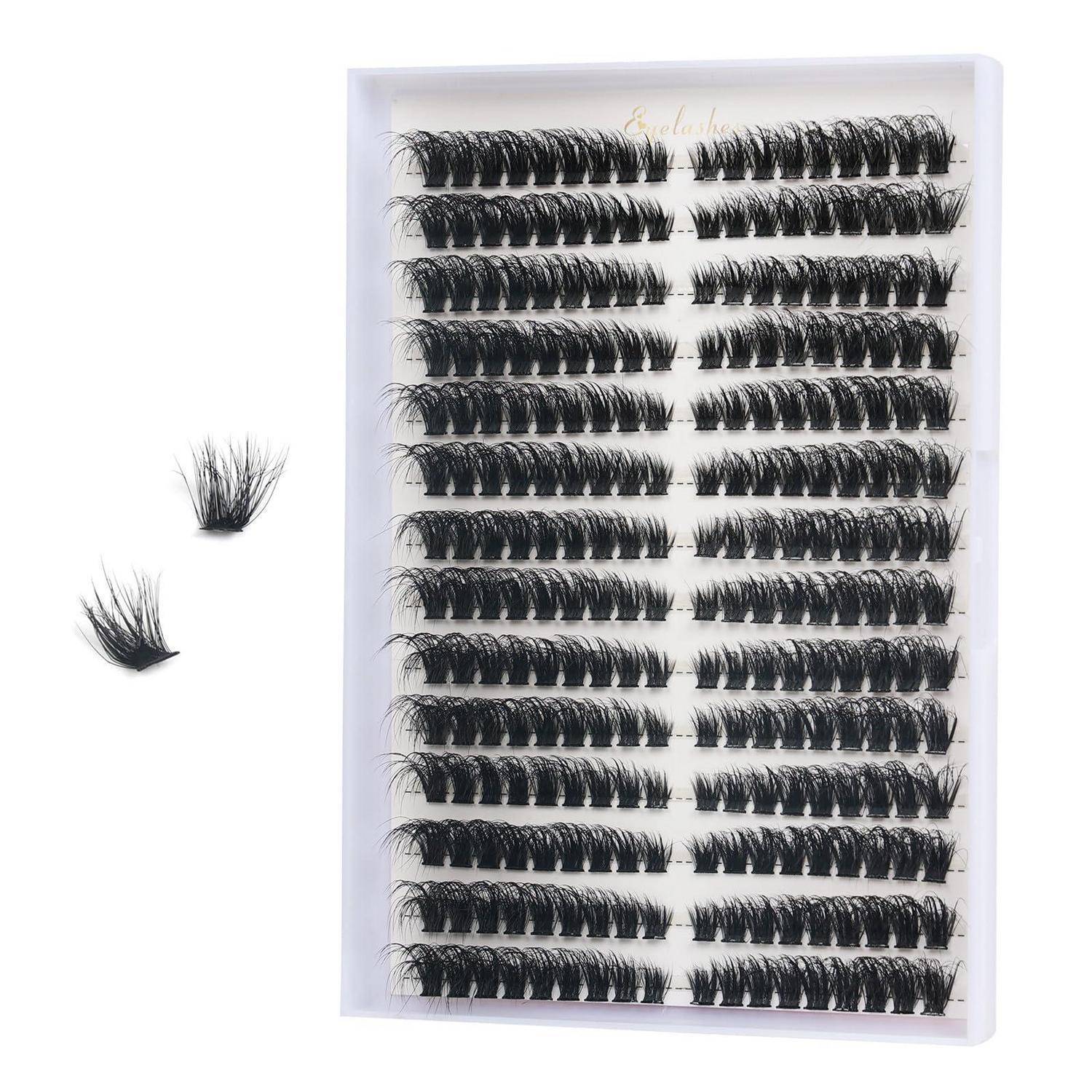 Blatt mit falschen Wimpern in mehreren Reihen, mit zwei lockeren Wimpernbündeln daneben auf weißem Hintergrund.