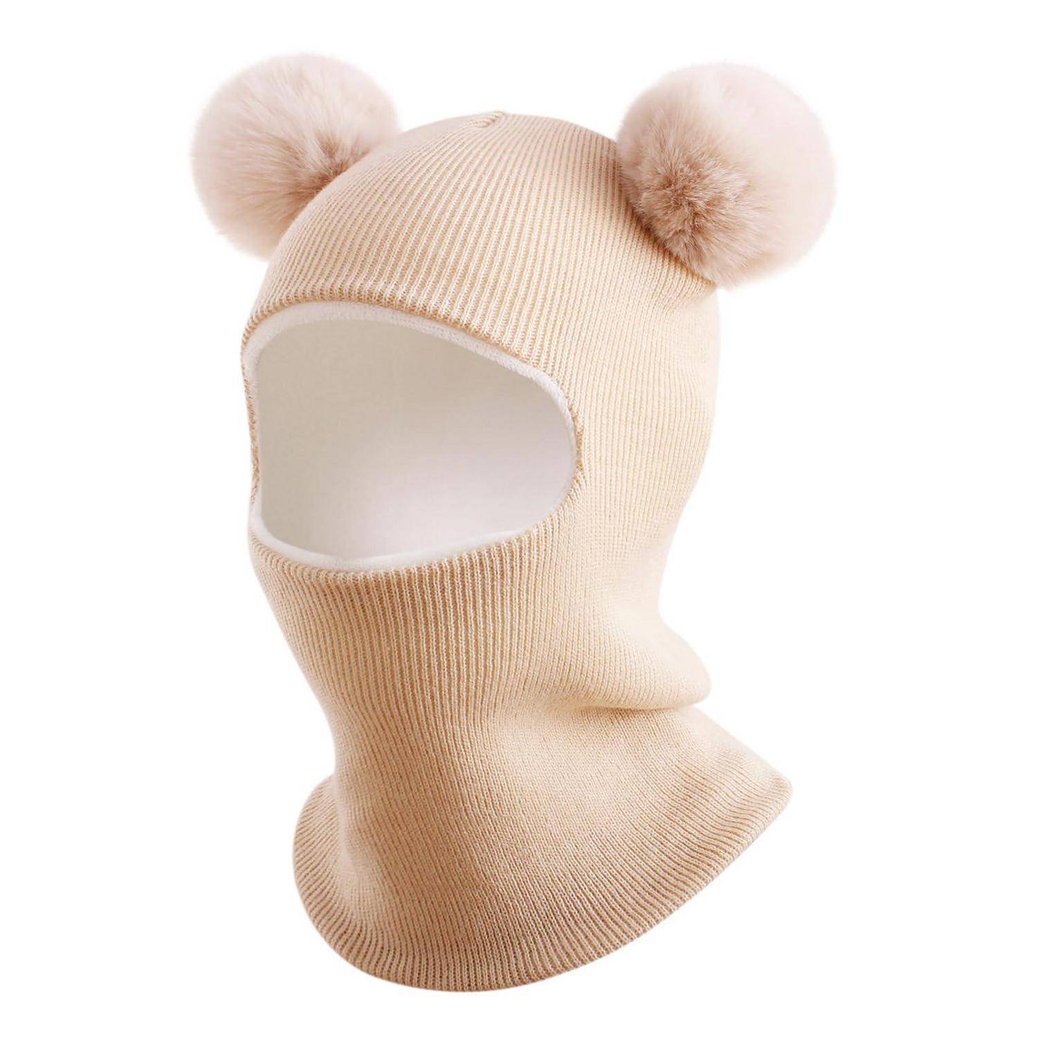 Beigefarbene gerippte Strickwollmütze mit Bommel-Ohren, die Kopf und Nacken bedeckt.