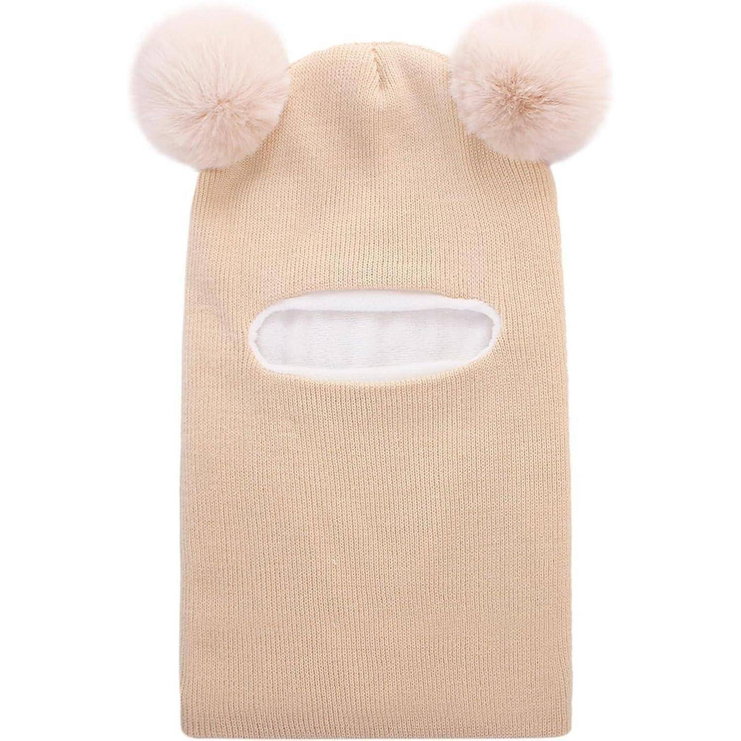 Beige Strickbalaklave mit zwei flauschigen Pompons oben und einer horizontalen Gesichtöffnung.