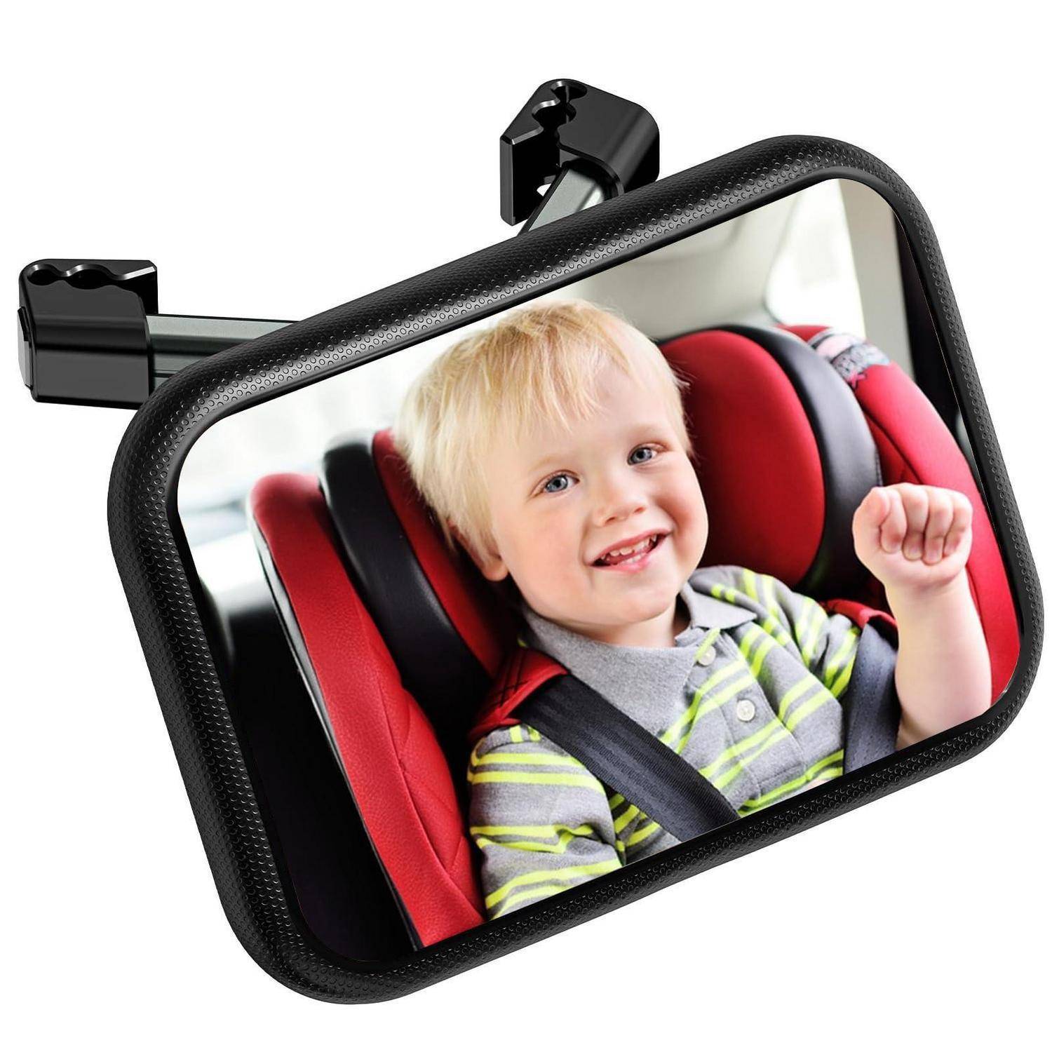 Rückspiegel mit einem lachenden Kind in einem roten Kindersitz, verwendet um ein rückwärts gerichtetes Kind für den Fahrer sichtbar zu machen.