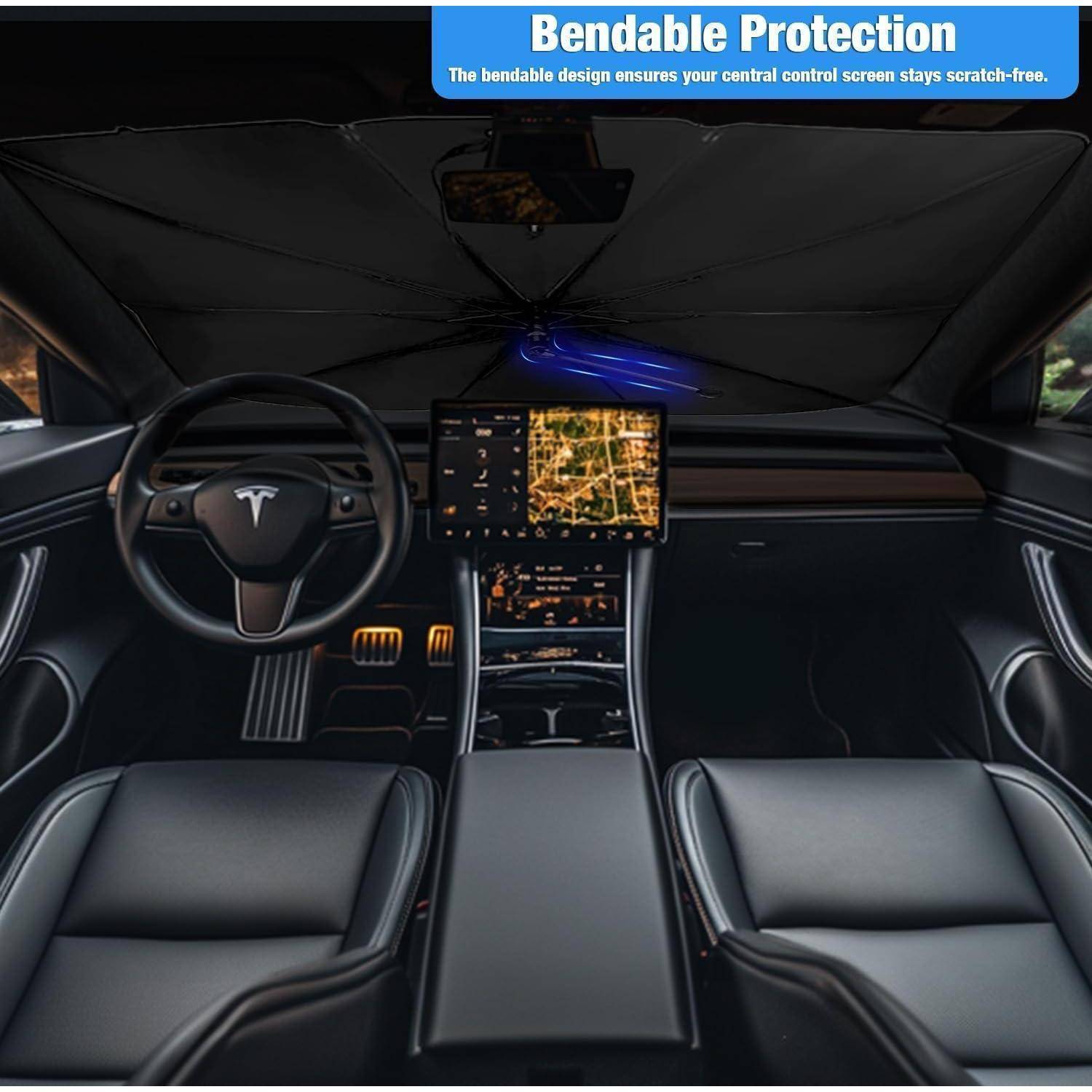 Innenraum eines Tesla mit einem zusammengeklappten Windschutzscheibensonnenrollo mit der Bezeichnung „Bendable Protection