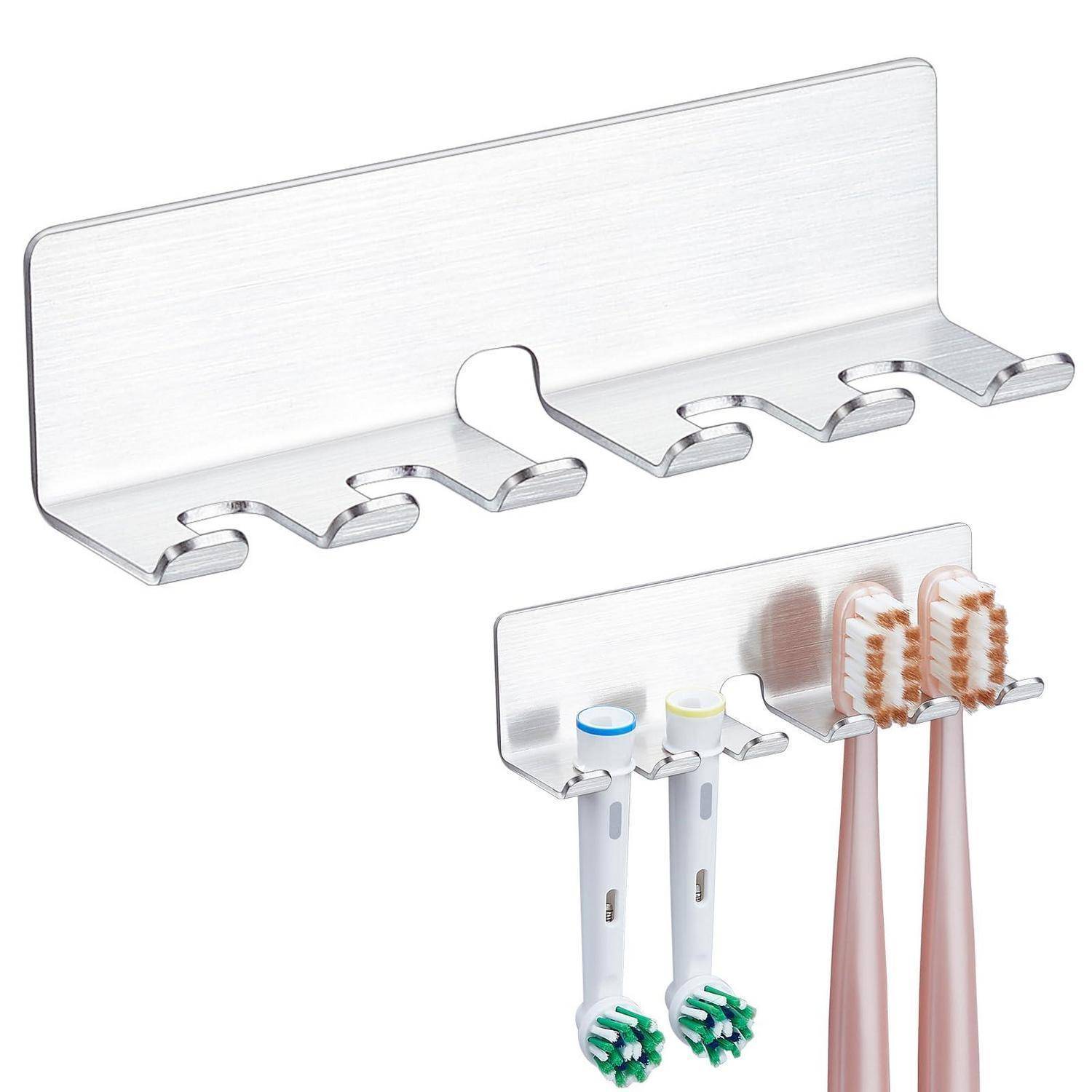 Edelstahl-Zahnbürsten- und Zahnpastahalter zur Wandmontage mit mehreren Fächern, dargestellt leer und in Gebrauch mit elektrischen Zahnbürsten und Tuben.