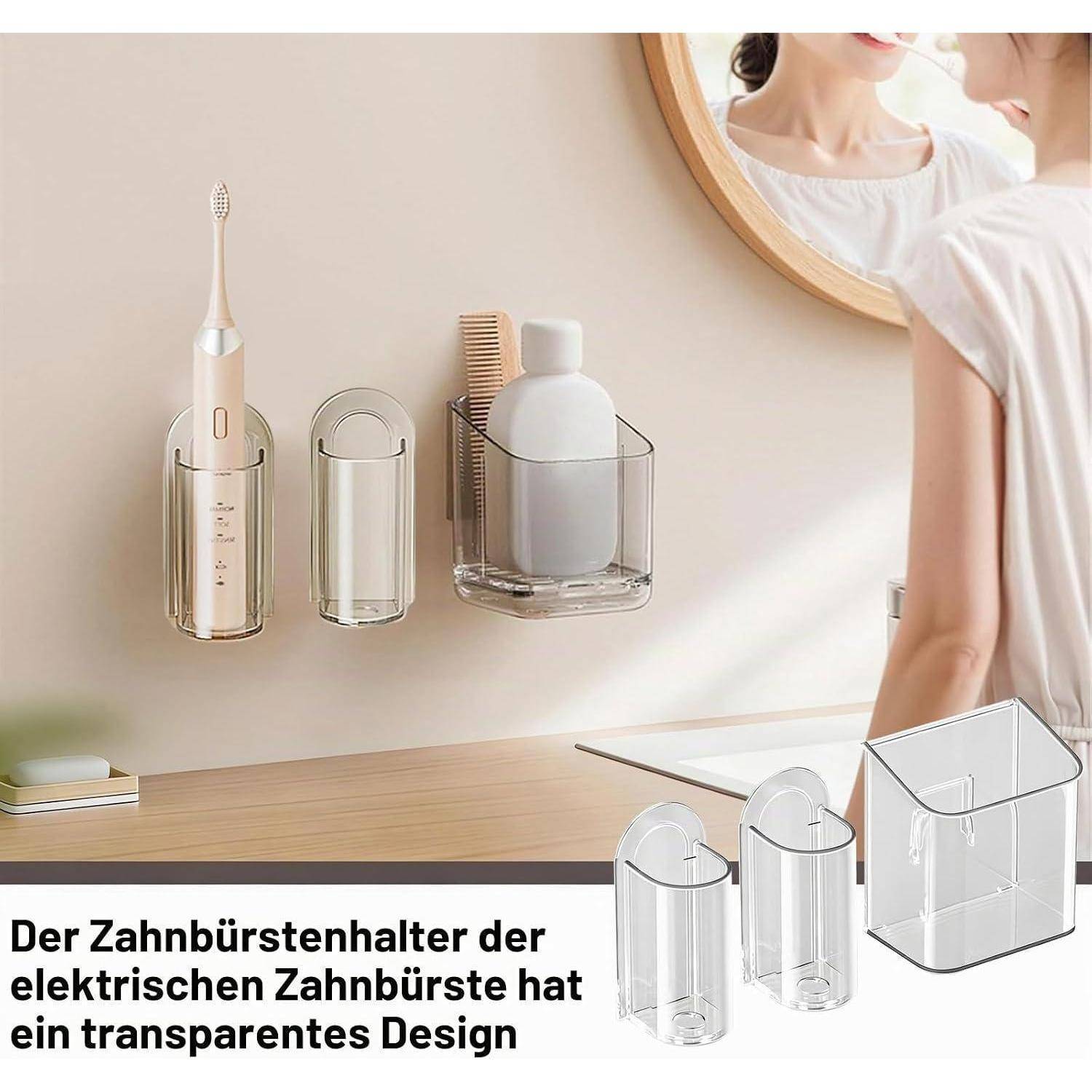 Transparente wandmontierte Badezimmerhalter für eine elektrische Zahnbürste, Zahnbürstenkappen und Zahnpasta, dargestellt neben einem Spiegel.