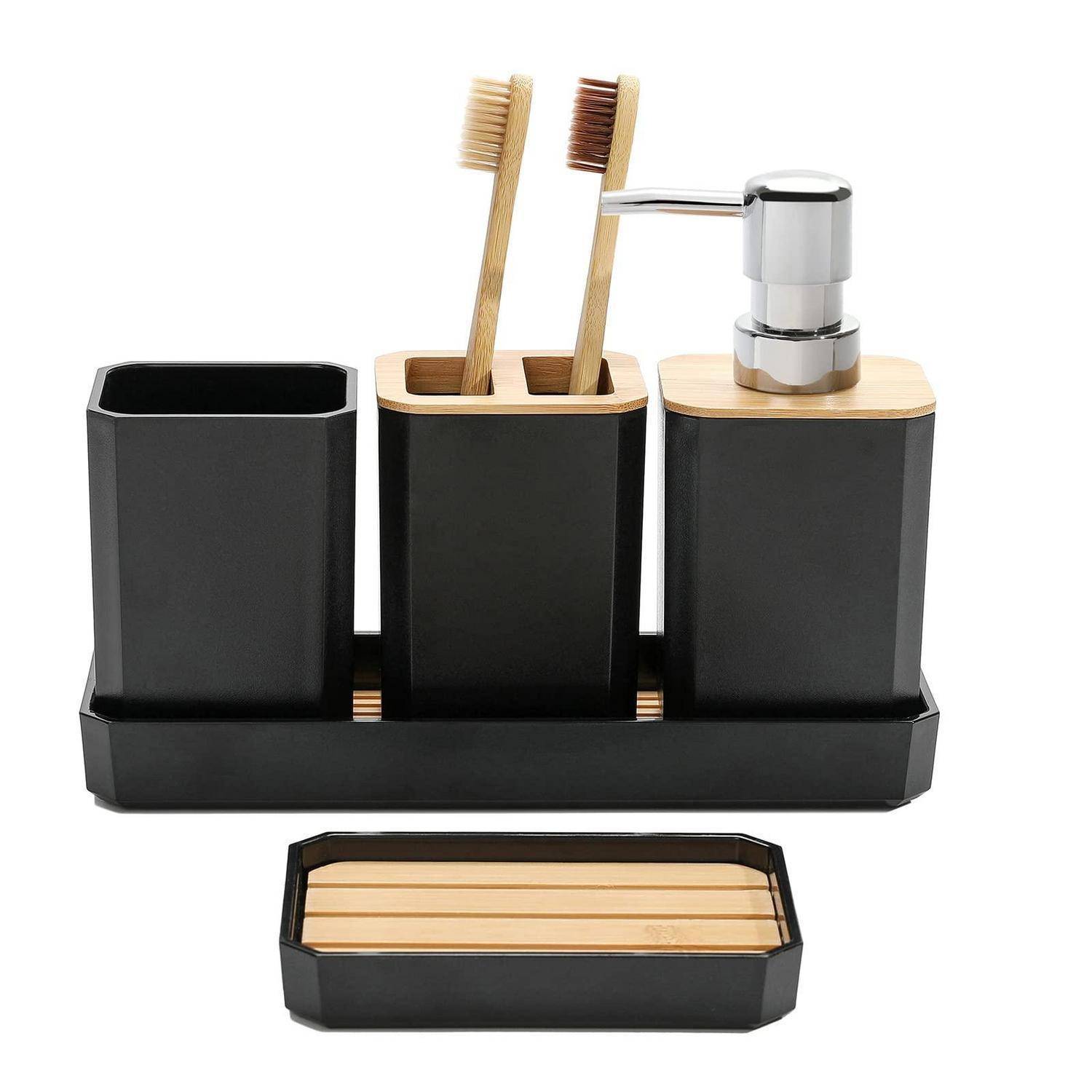 Schwarzer Badezimmer-Organizer-Set mit Seifenspender, zwei Zahnbürstenhaltern und einer Seifenschale auf einer passenden Basis.