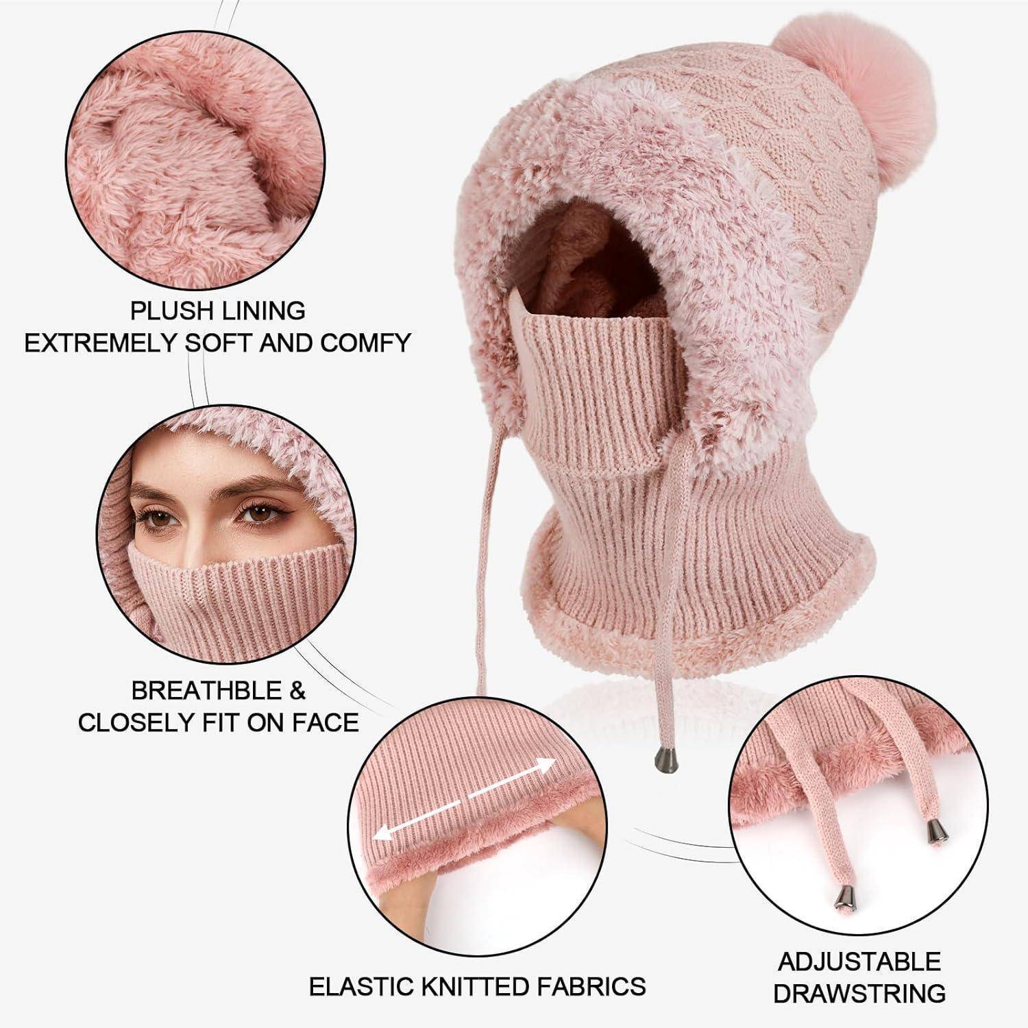 Rosa Wintermütze mit Fleecefutter und gestrickter Gesichtsmaske, Pompon an der Spitze und verstellbaren Zugkordeln; eingefügte Beschriftungen zeigen weiches Futter, atmungsaktiven Sitz und elastisches Material.