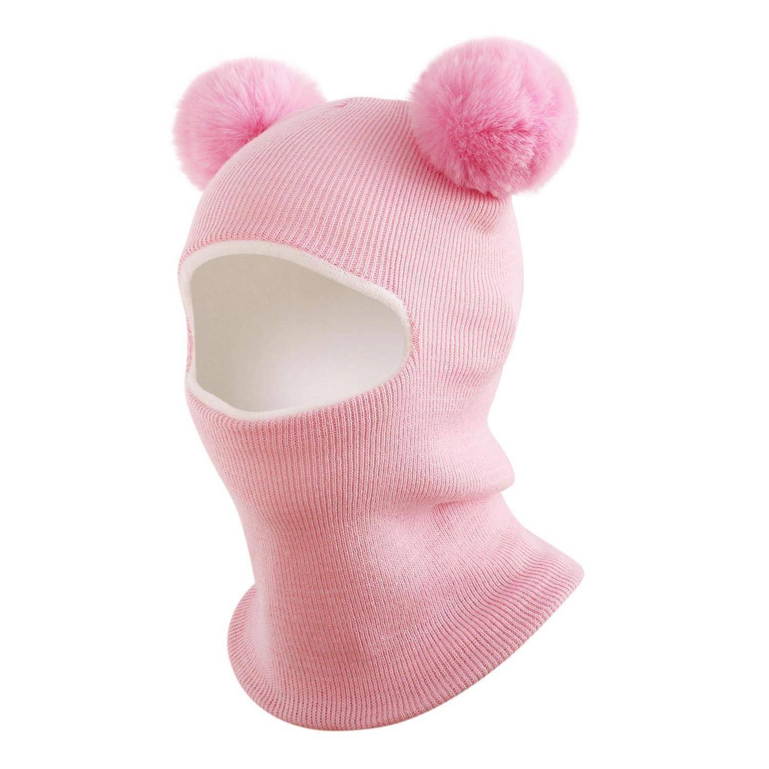 Rosa gestrickte Skimaske mit Gesichtsöffnung und zwei flauschigen Bommel oben