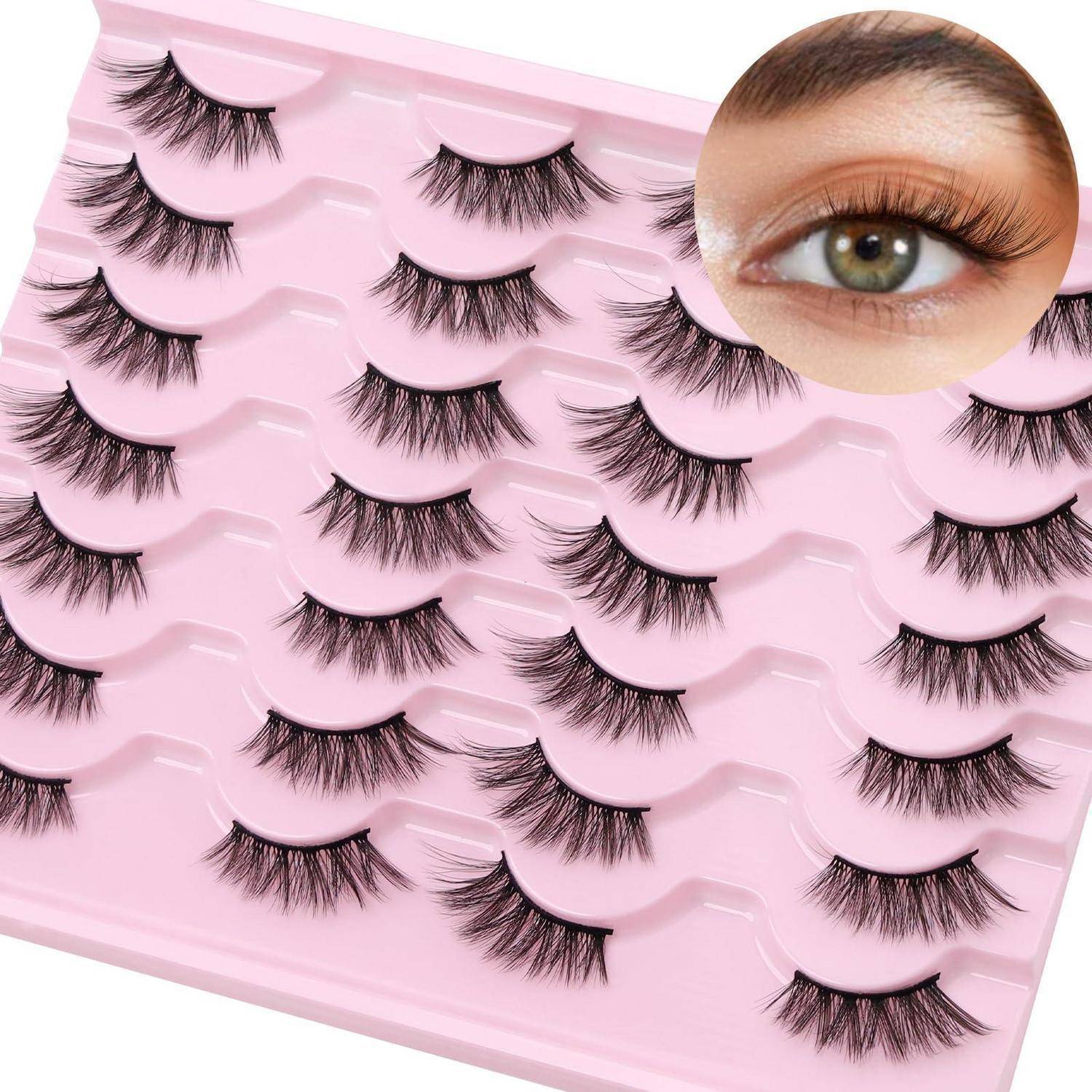 Rosa Tablett mit mehreren künstlichen Wimpern, mit einer eingefügten Nahaufnahme eines grünen Auges mit langen Wimpern.