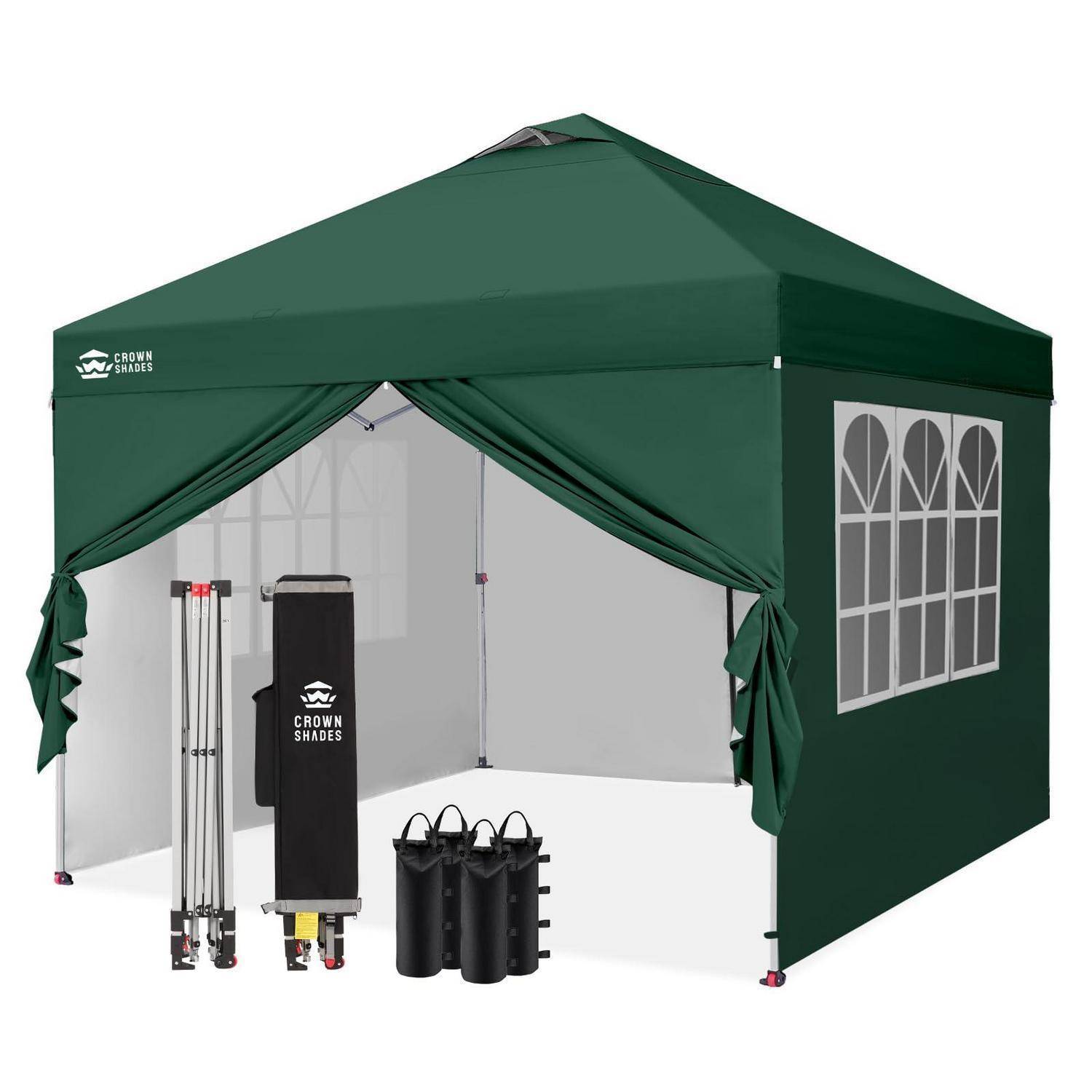 Grüner Pop-up-Pavillon mit offener Vorderseite, seitlichem Fensterfeld und im Inneren angezeigtem Bündel von tragbaren Zubehörteilen.
