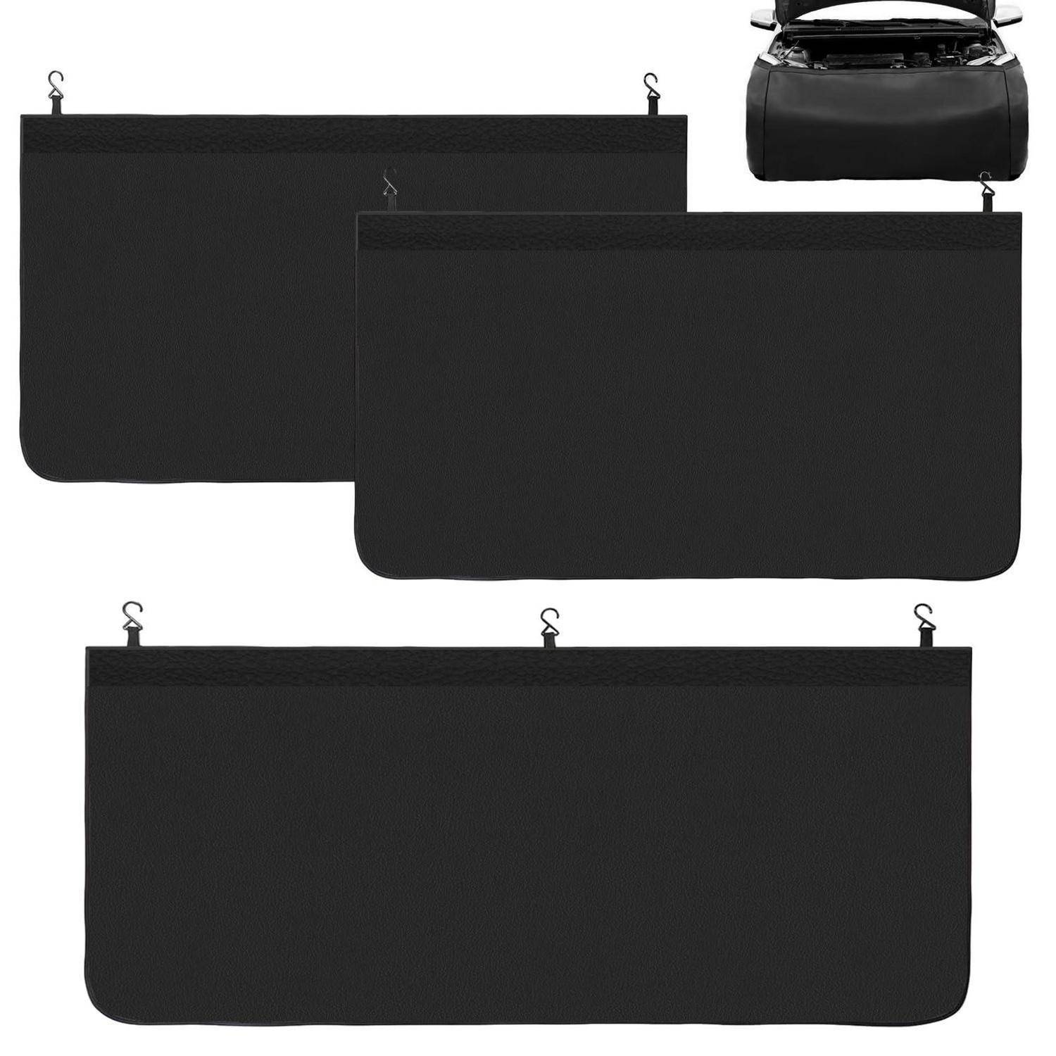 Drei schwarze Stoff-Ladeteilungen/Sichtschutzpanels mit Aufhängehaken in verschiedenen Größen für einen Fahrzeugkofferraum oder ein Schrägheck.