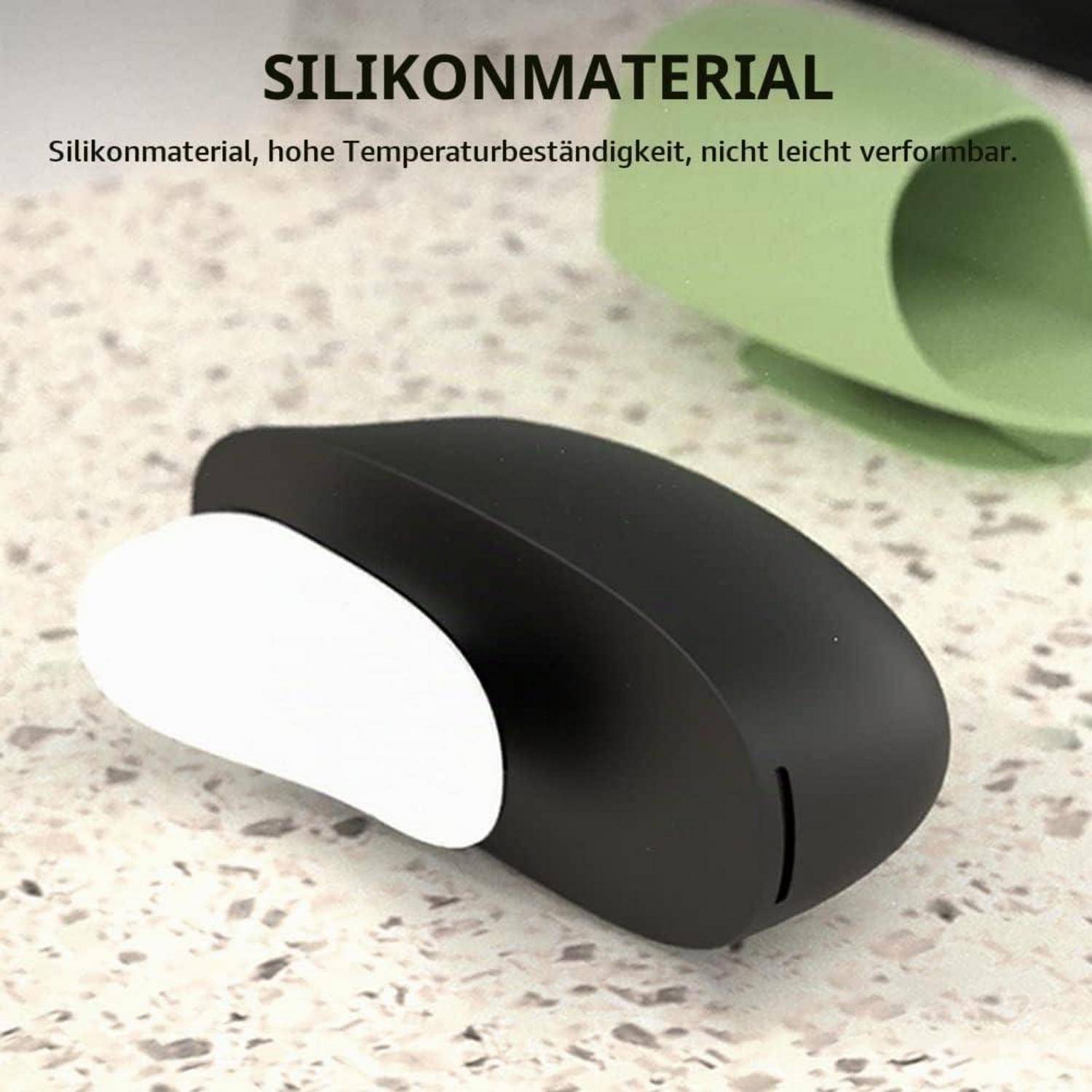 Schwarze Silikon-Maus mit weißem Seitenakzent auf einer gesprenkelten Oberfläche, dargestellt als hitzebeständig und nicht leicht verformbar.