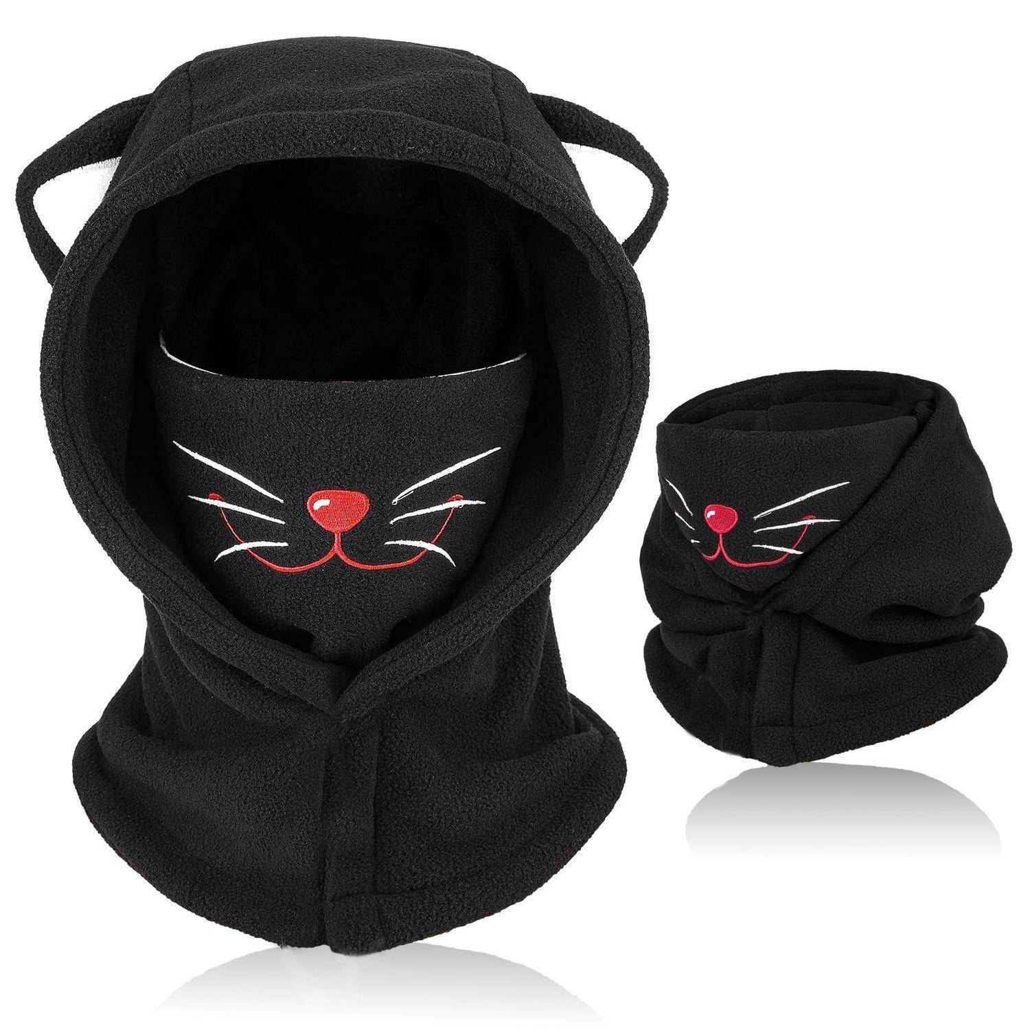 Schwarze Kapuzengesichtsmaske mit Katzenohren und bestickter Katzennase und Schnurrhaaren, gezeigt in Vorder- und eingeklappter Seitenansicht.