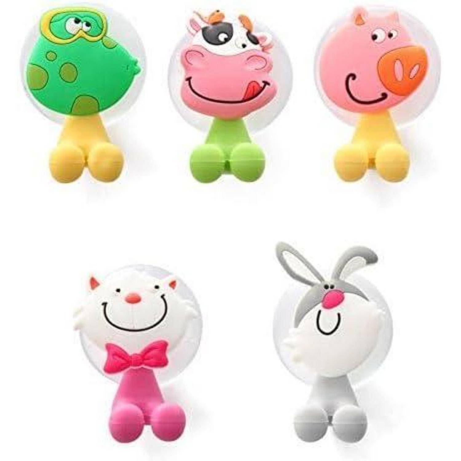 Fünf bunte Cartoon-Tierspielzeugfiguren mit runden Köpfen und kleinen Füßen, darunter ein grüner Frosch, eine rosa Kuh, ein rosa Schwein, eine weiße Katze mit Schleife und ein graues Kaninchen.