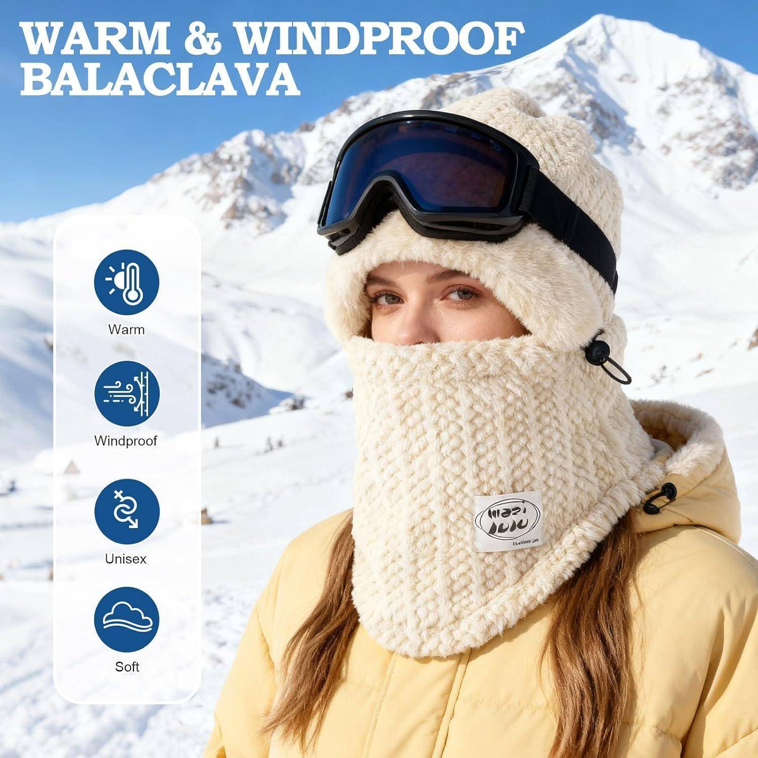Frau, die eine warme, windsichere Sturmhaube und Skibrillen in einer verschneiten Berglandschaft trägt; Text sagt „WARME & WINDSICHERE STURMHAUBE