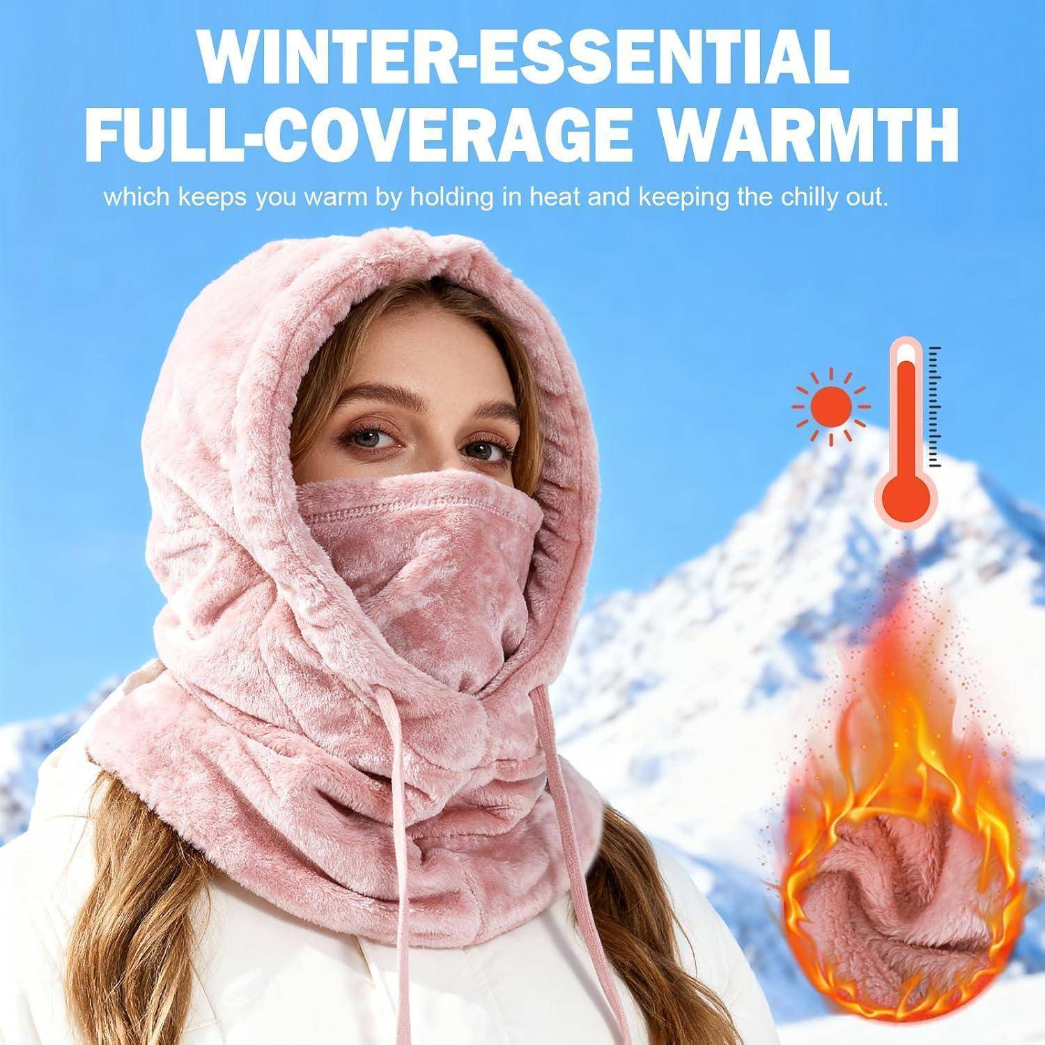Eine Frau, die eine rosa Winterhaube mit vollständiger Gesichtsbedeckung und einen Nackenflausch trägt, wird mit dem Text „WINTER-ESSENTIAL FULL-COVERAGE WARMTH