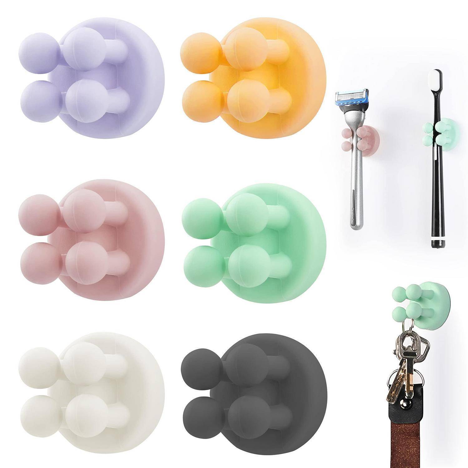 Bunte Silikon-Wandhaken in sechs Farben, die Rasierer und einen Schlüsselanhänger halten; einfache selbstklebende Badezimmer- oder Flurorganizer.