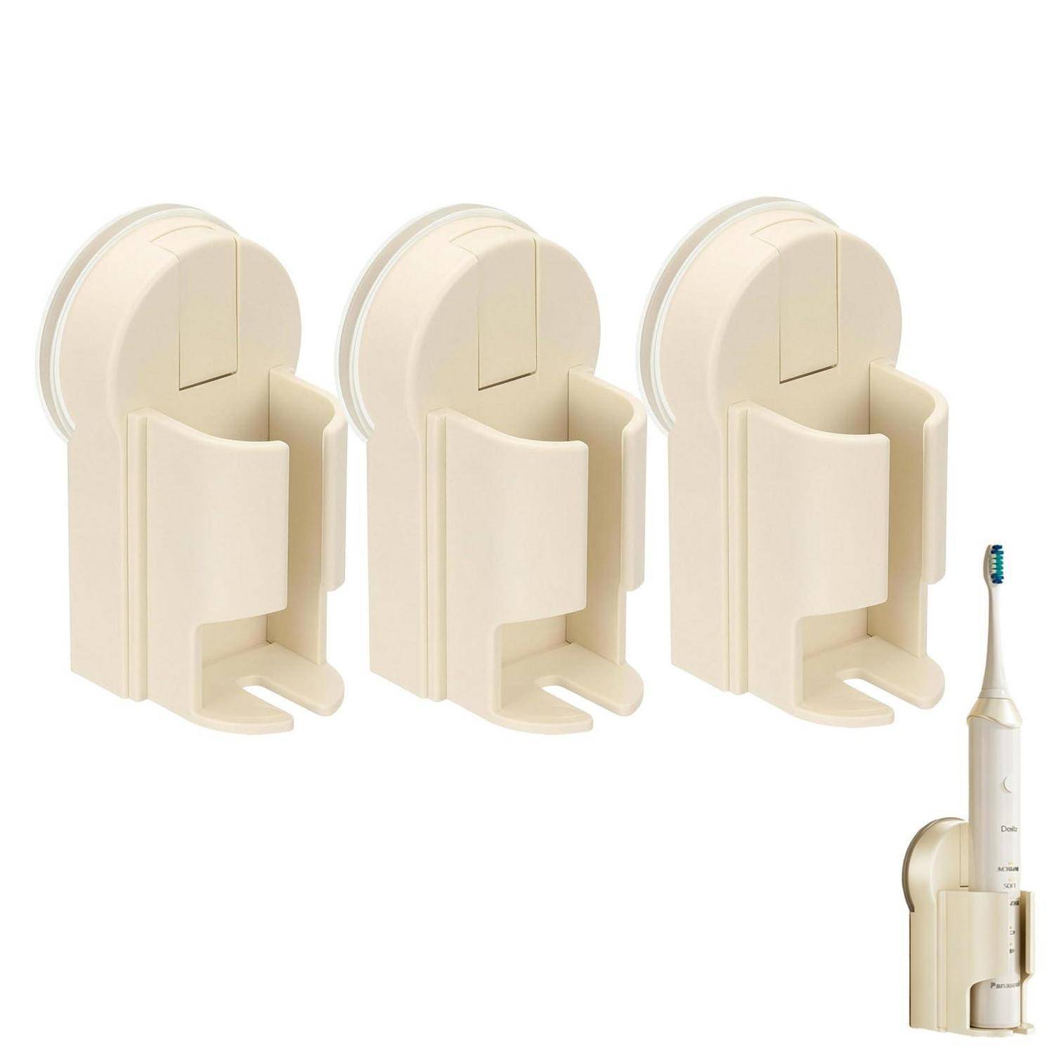 Drei beige wandmontierte Zahnbürstenhalter, die in einem Produktbild gezeigt werden, wobei einer auf der rechten Seite eine elektrische Zahnbürste hält.