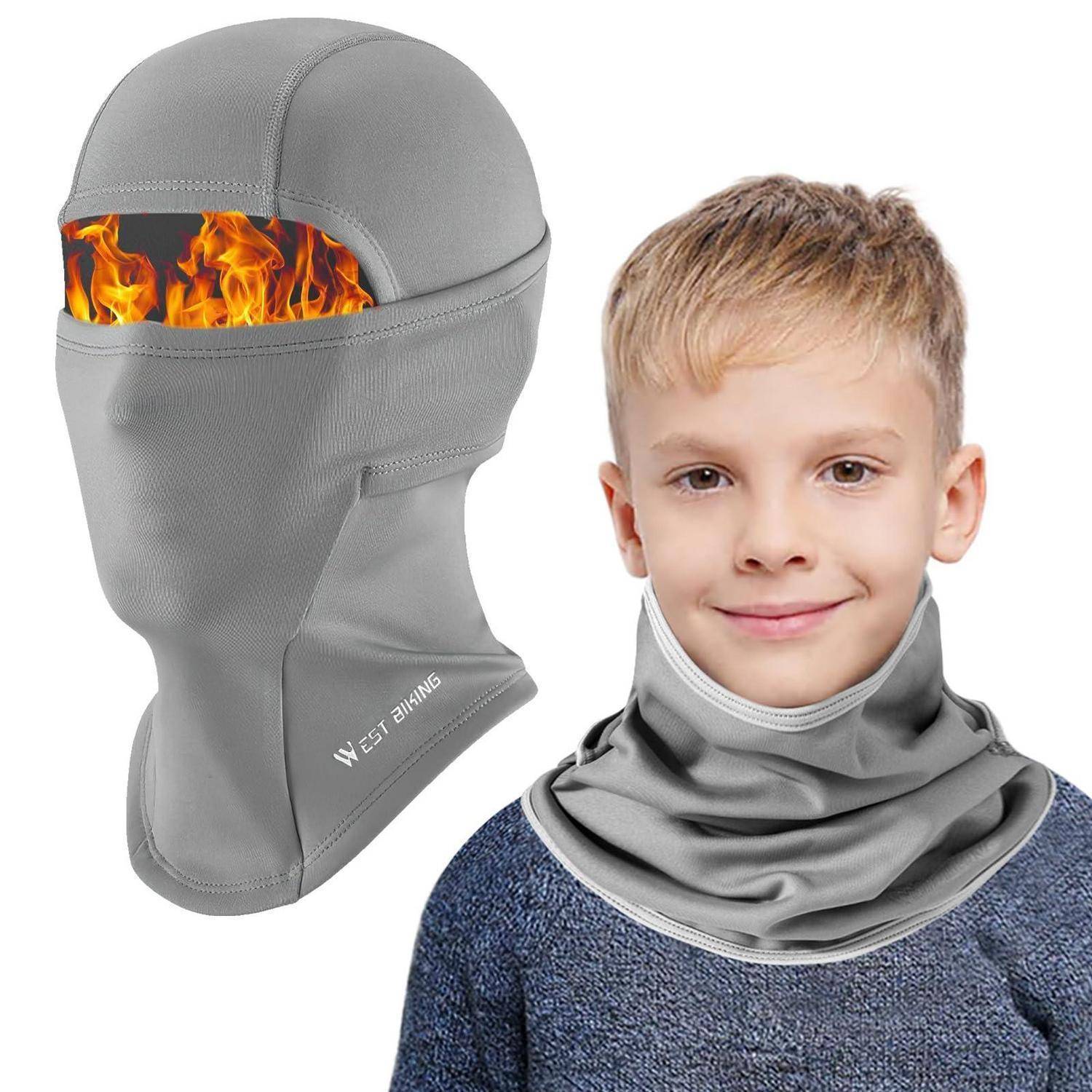 Graue flammenhemmende Sturmhaube und Nackenmaske, gezeigt an einem Kind; eingefügte Feuer-Grafik hebt den Wärmeschutz hervor.
