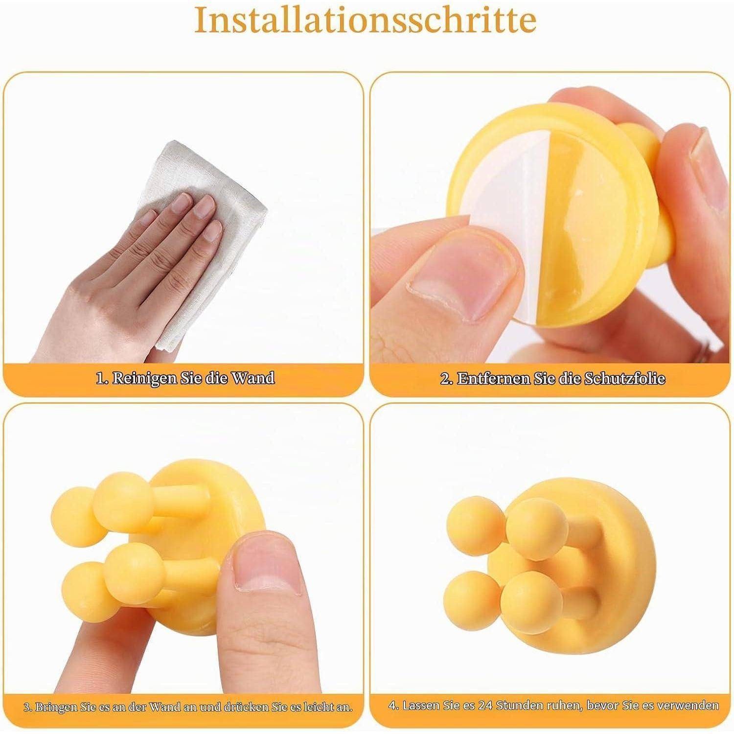 Vierschrittiger Installationsleitfaden auf Deutsch: Wand reinigen, Schutzfolie entfernen, Saugnapfhaken an die Wand kleben, dann 24 Stunden vor Gebrauch warten.