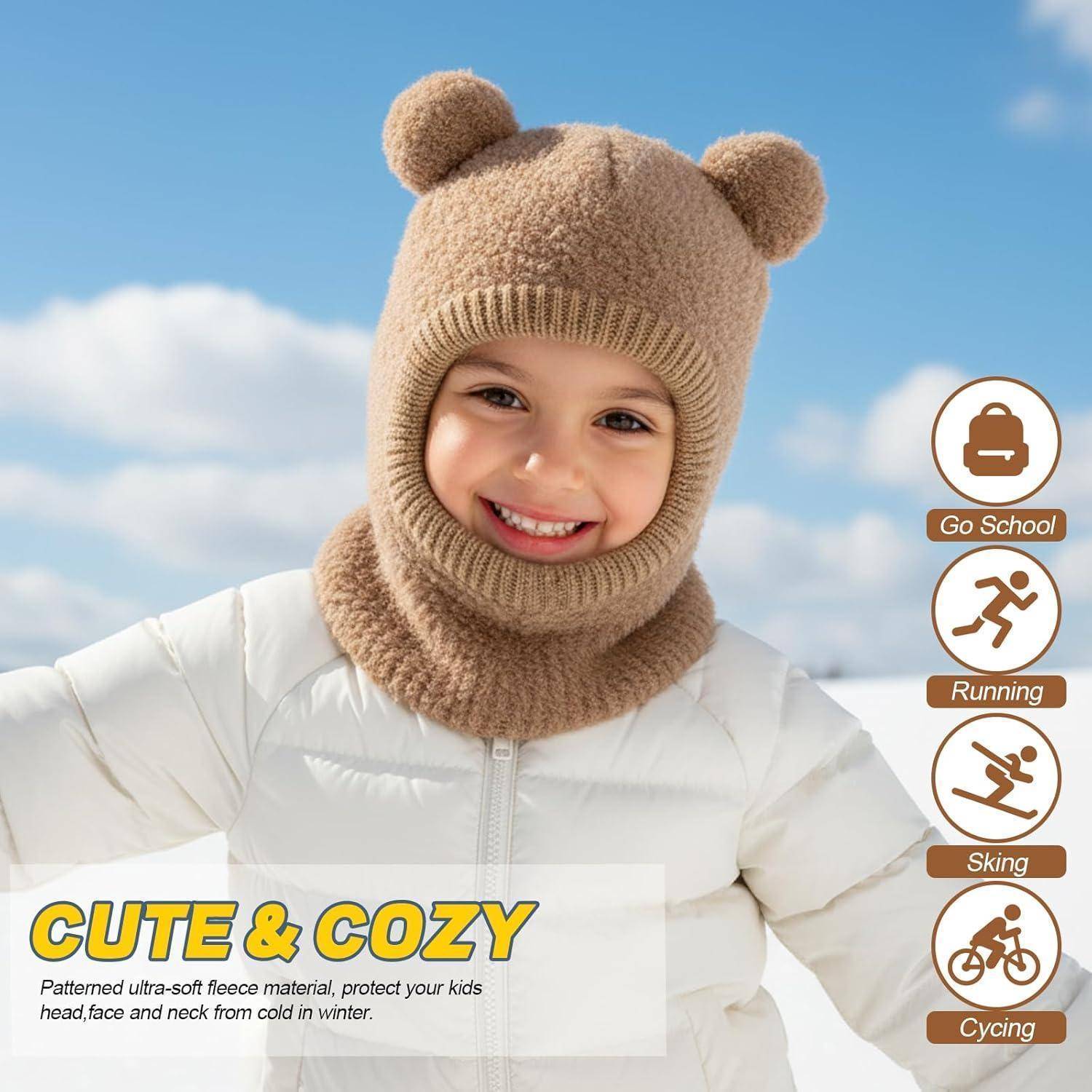 Lachendes Kind in Wintermütze und Schal mit weißer Jacke; die Anzeige sagt „NIEDLICH & GEMÜTLICH" und bewirbt gemustertes ultraweisches Fleece für Wärme.