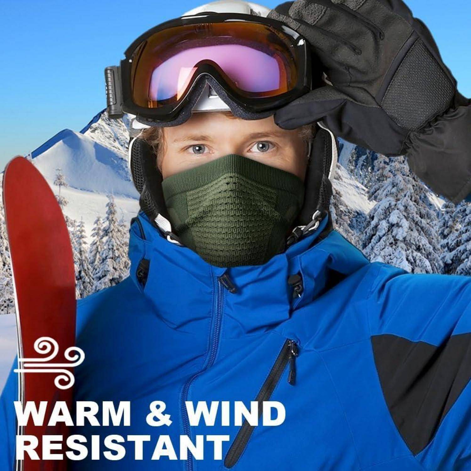 Skifahrer in blauer Jacke, Schutzbrille, Maske und Handschuhen auf verschneitem Berg; Text sagt „WARM & WINDRESISTENT".