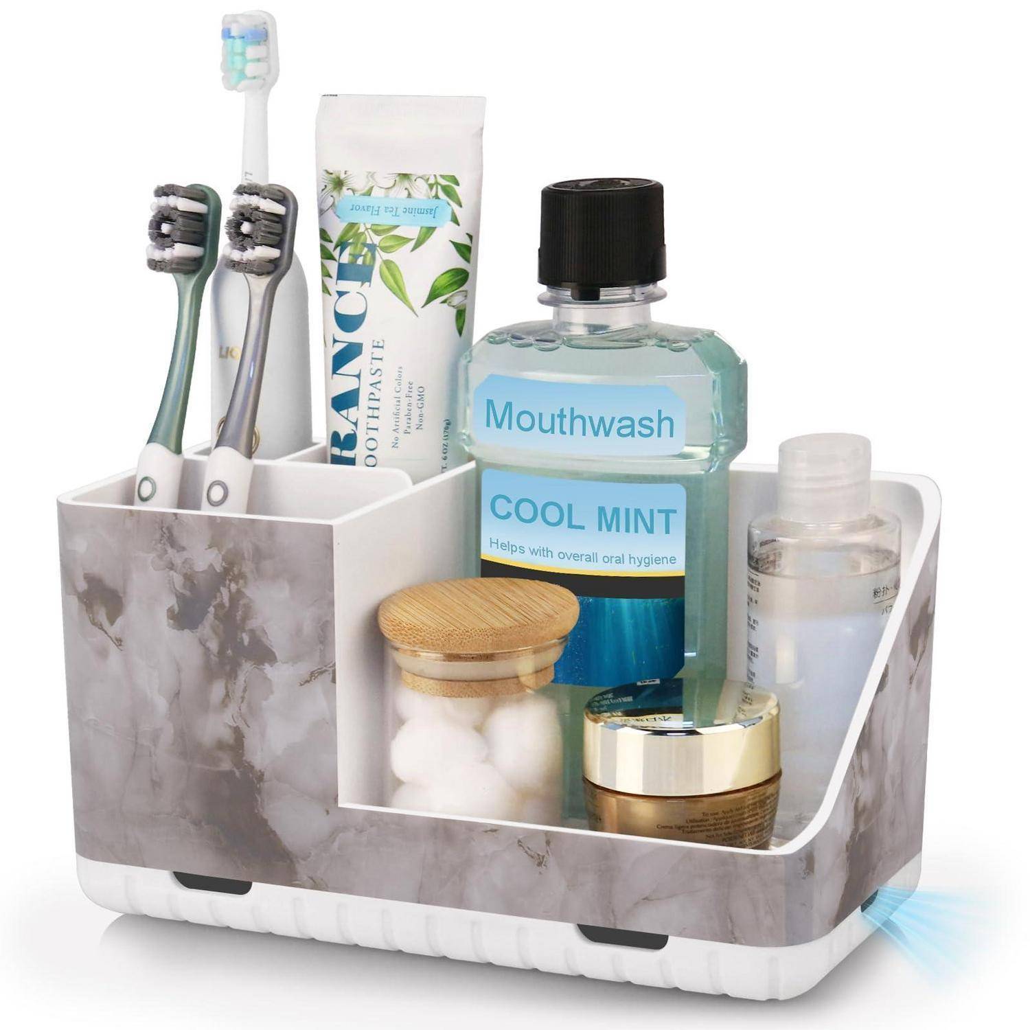 Badezimmer-Arbeitsplatte-Organizer mit zwei Zahnbürsten, Zahnpasta, Mundwasser und kleinen Toilettenartikel-Behältern.
