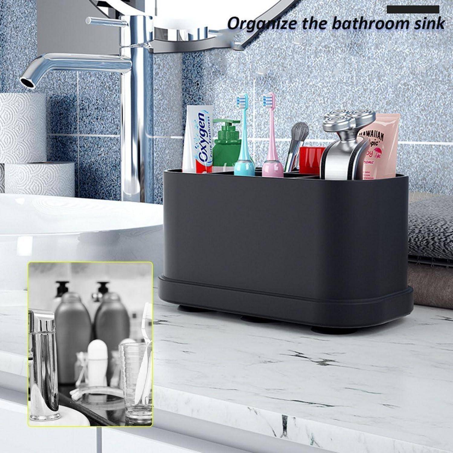 Badezimmer-Organizer-Tablett, das Zahnbürsten, Zahnpasta und Toilettenartikel neben einem Wasserhahn auf einer Arbeitsplatte hält.