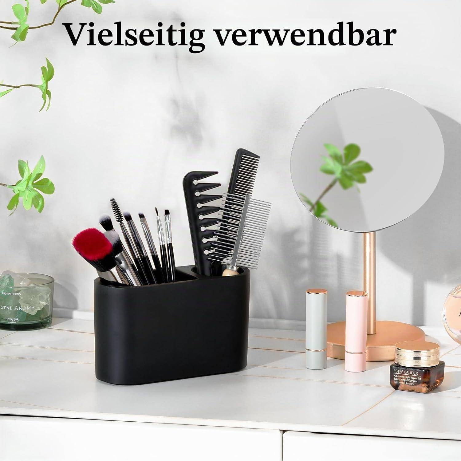 Schwarzer Organizer mit Makeup-Pinseln und Kämmen neben einem Schminkspiegel, mit dem Text „Vielseitig verwendbar