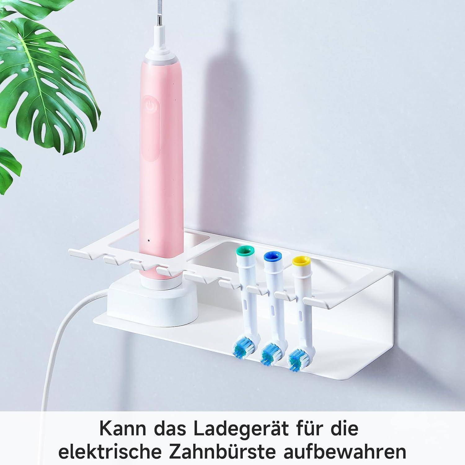 Rosa elektrische Zahnbürste auf einem weiß wandmontierten Ladegeräthalter mit Aufbewahrungsfächern für Bürstenköpfe.