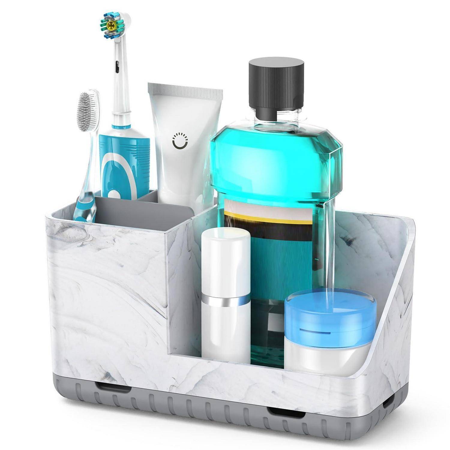 Badezimmer-Organizer im Marmor-Design, der eine Zahnbürste, Zahnpasta, eine Mundspülflasche und Hautpflegegläser hält.