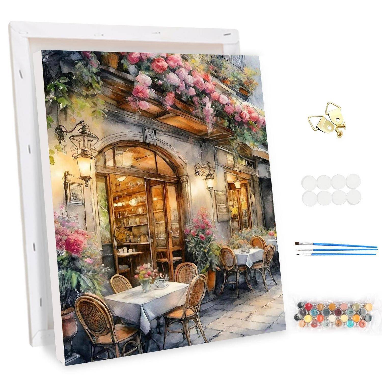 Leinwandgemälde eines blumenbedeckten europäischen Cafés mit Außentischen und Stühlen, dargestellt als Malen-nach-Zahlen-Set mit Pinseln, Farbdosen und Wandhaken.