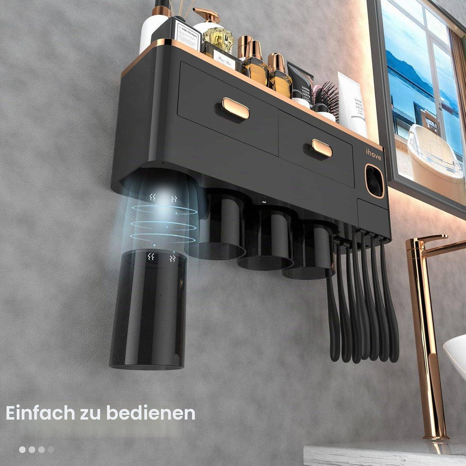 Wandmontierter schwarzer Badezimmer-Organizer mit Schubladen, Zahnbürstenhaltern und Spendern über einem Waschbecken; deutscher Text liest sich „Einfach zu bedienen