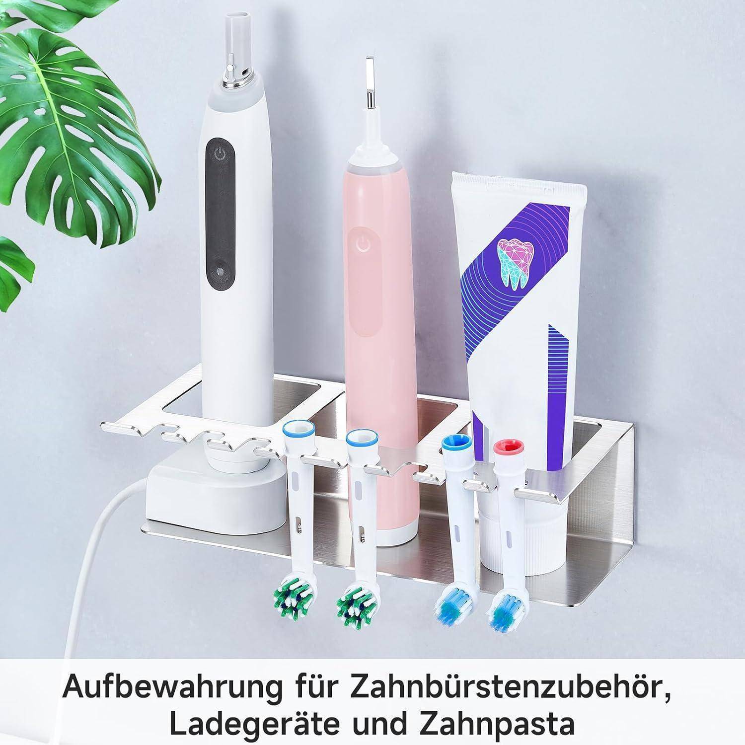 An der Wand befestigter Badezimmerorganizer, der zwei elektrische Zahnbürsten, zwei Bürstenköpfe, ein Ladegerät und Zahnpasta hält.