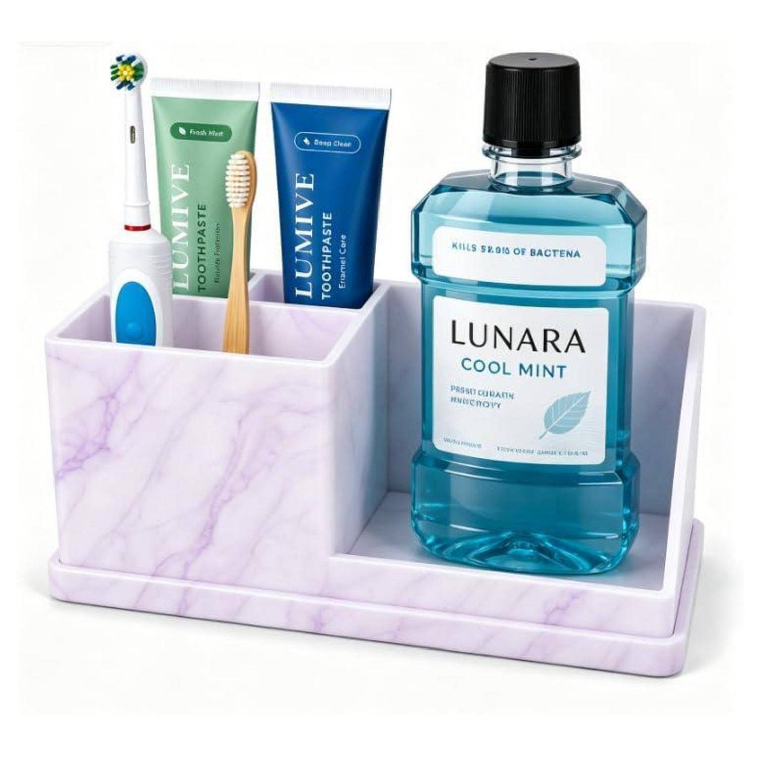Badezimmer-Organizer mit Marmor-Optik, der eine Zahnbürste, zwei Zahnpasta-Tuben und eine blaue Mundwasser-Flasche mit der Aufschrift „LUNARA Cool Mint