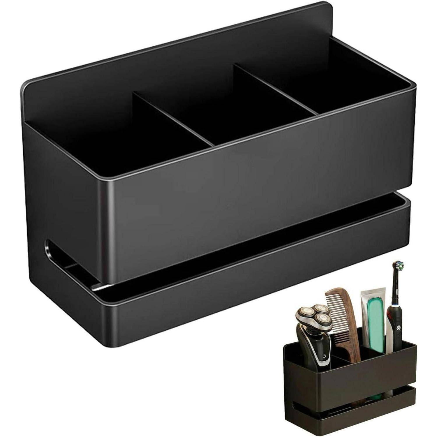 Schwarzer Arbeitsflächenorganizer mit drei Fächern und einer unteren Tablett-Basis, gezeigt mit Rasierklingen, Kamm, Zahnbürste und Zahnpasta.