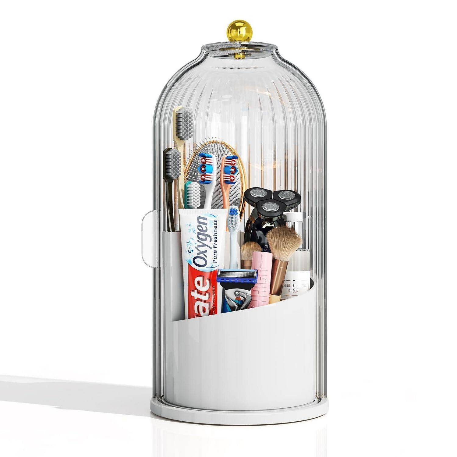 Klare Badezimmerorganizer mit Kuppeldeckel, der Zahnbürsten, Zahnpasta, Rasierer und Pflege-Werkzeuge in einem weißen Behälter hält.