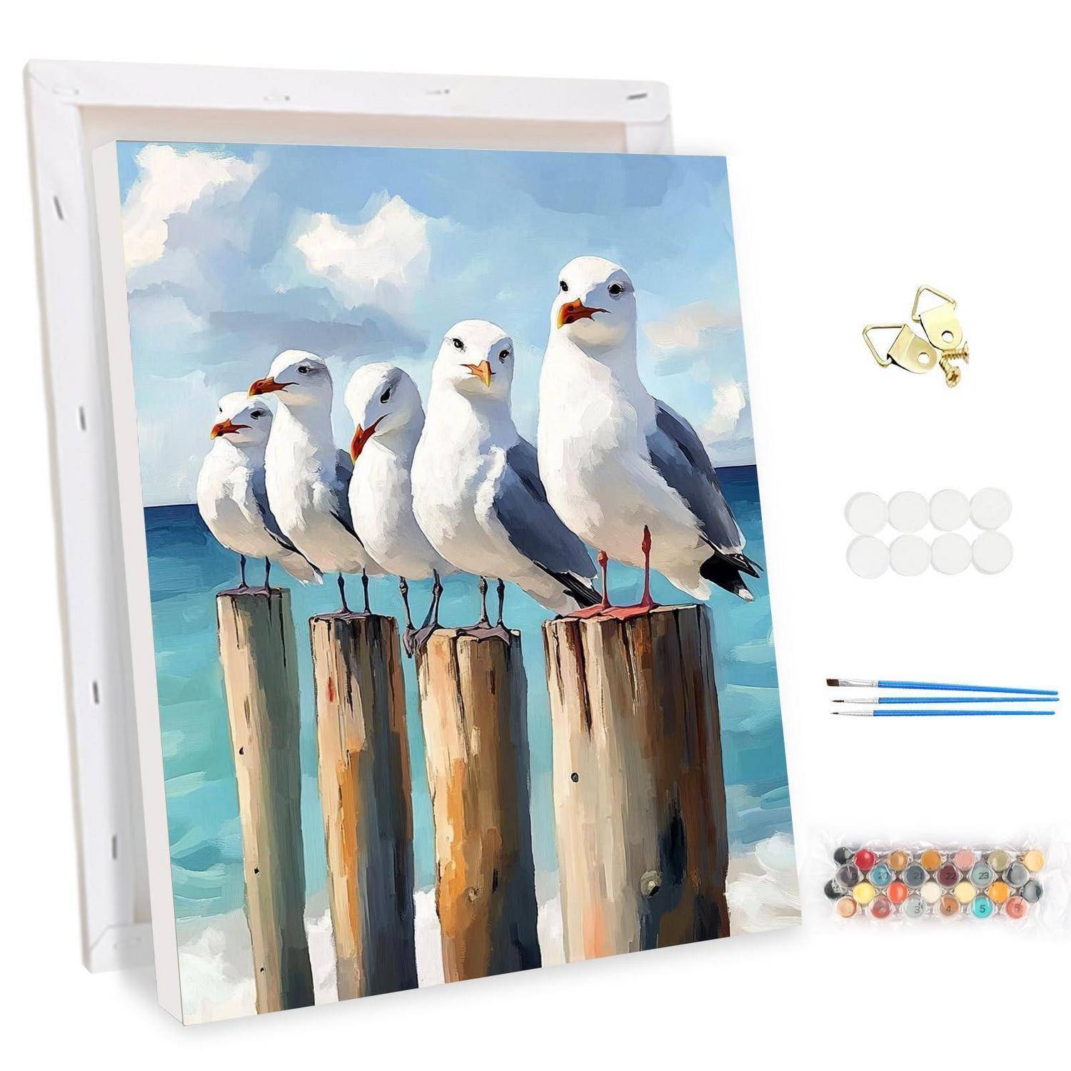 Malbuch-Set mit vier Möwen auf Holzpfählen am Meer, mit enthaltenen Haken, Farben und Pinseln.