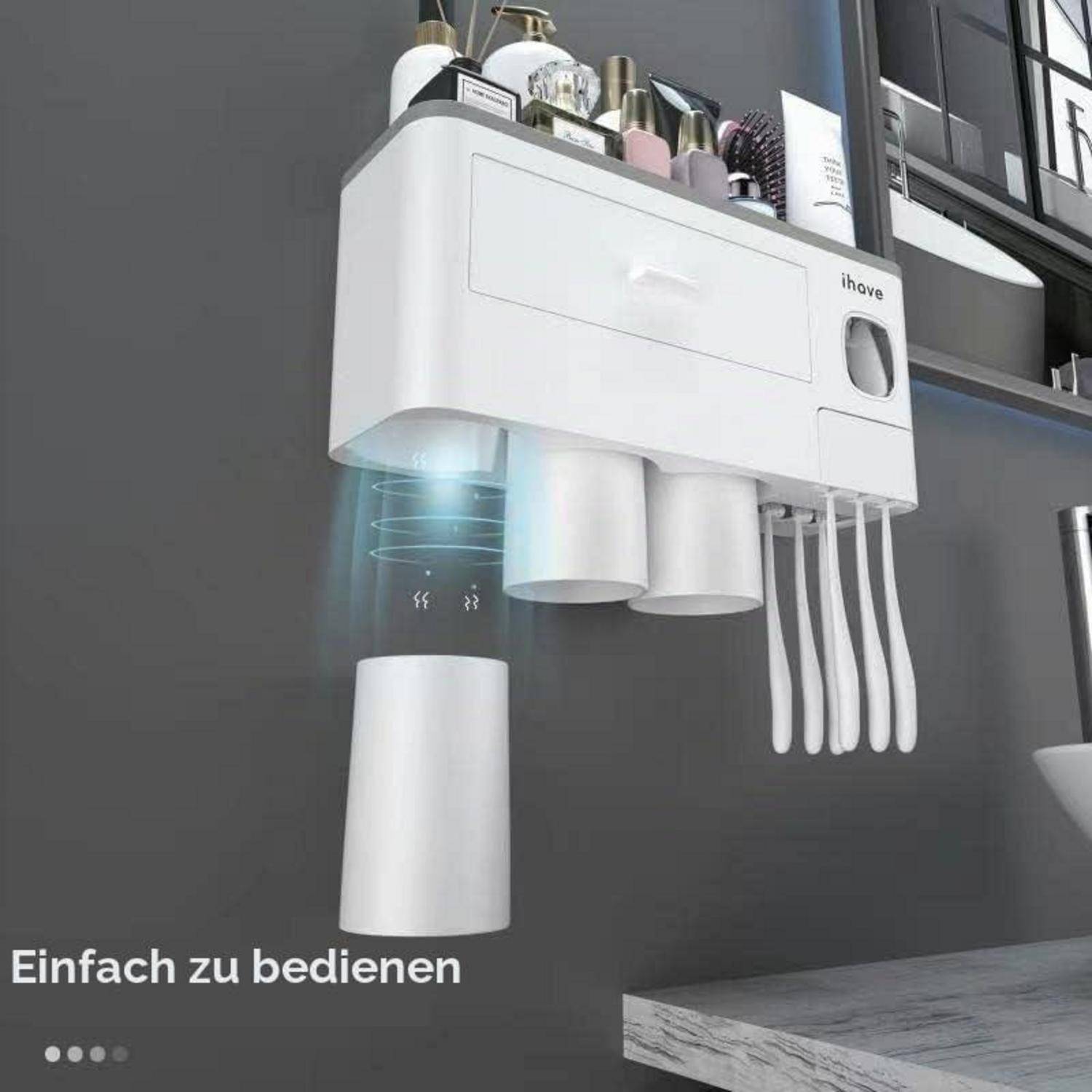 Wandmontierter weißer Küchenorganizer/Spender mit Bechern und Utensilien, mit einem schwebenden Becher darunter und deutschem Text „Einfach zu bedienen