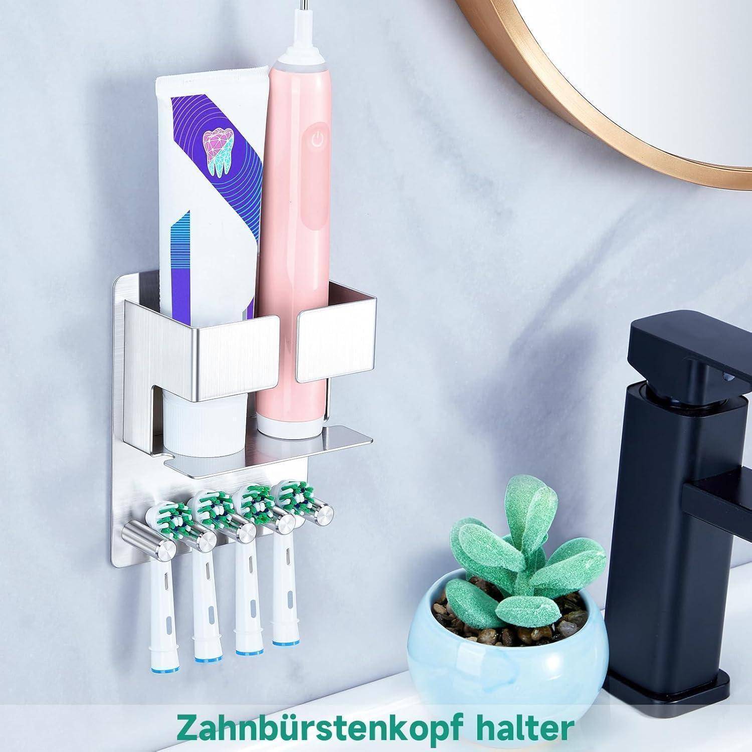 Wandmontierter Zahnbürstenhalter mit Schlitzen für zwei Zahnbürsten und vier Bürstenköpfe, abgebildet neben einer elektrischen Zahnbürste und Zahnpasta.