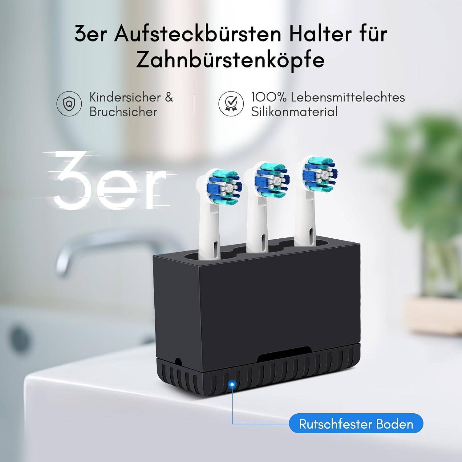 Produktbild eines schwarzen Zahnbürstenkopf-Halters mit drei Zahnbürstenköpfen, gekennzeichnet als kindersicher, bruchsicher, aus lebensmittelechtem Silikon gefertigt und mit rutschfestem Boden.