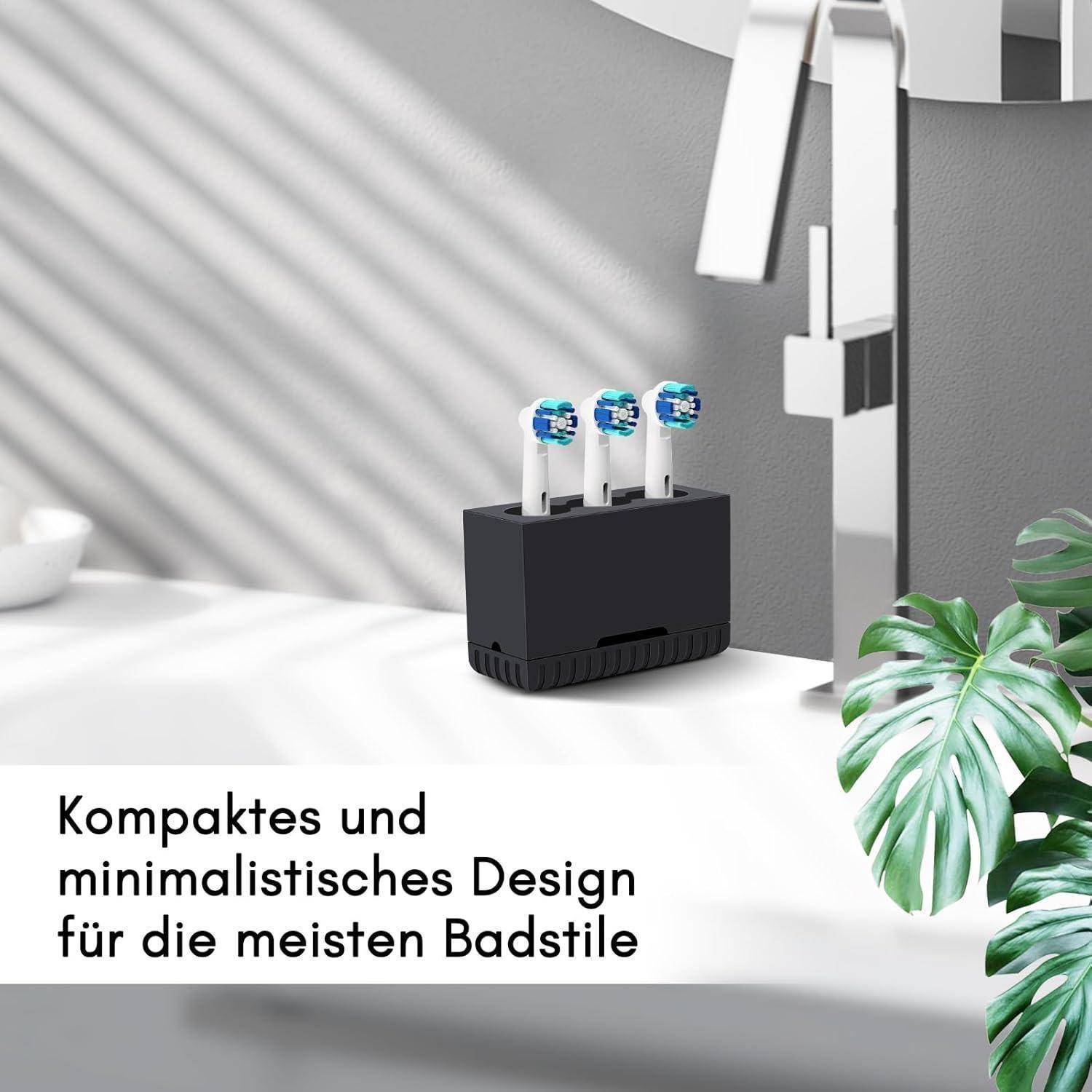 Kompakte elektrische Zahnbürsten-Ladestation mit drei Zahnbürsenköpfen in einer minimalistischen Badezimmerumgebung; deutscher Text lautet „Kompaktes und minimalistisches Design für die meisten Badstile